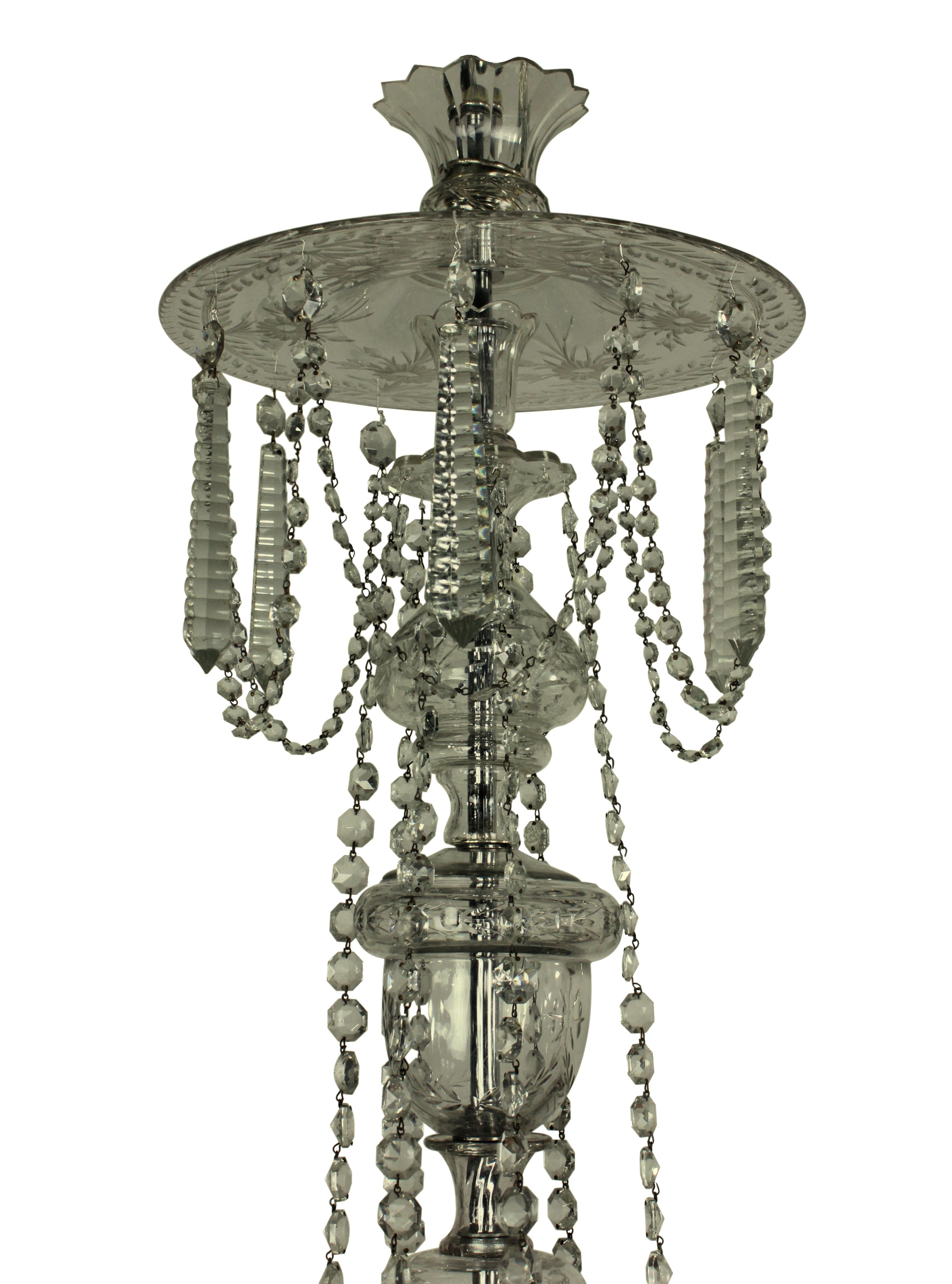 An English Edwardian twelve-branch cut-glass chandelier. Formerly a gasolier, of fine quality.

  