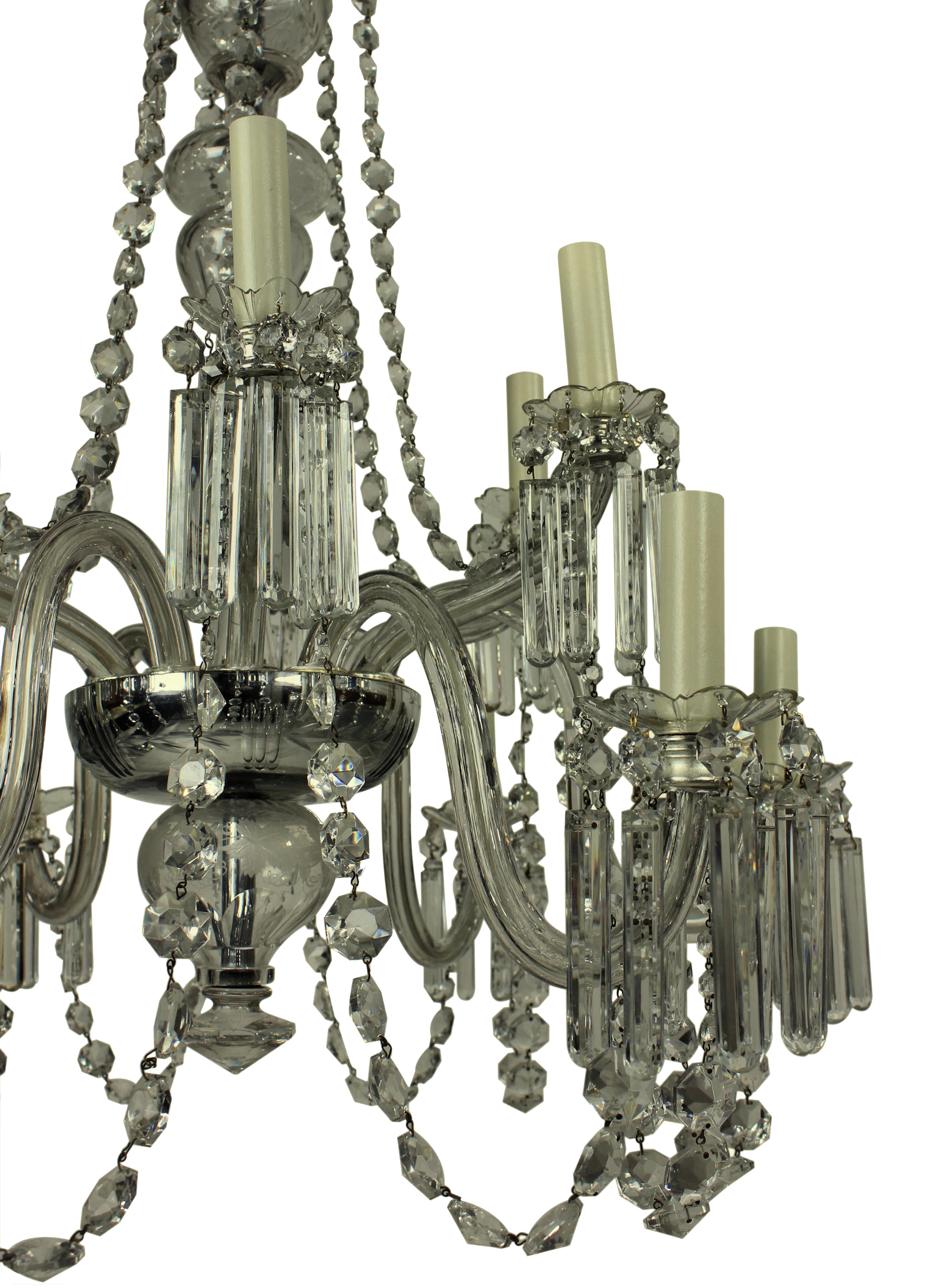 An English Edwardian twelve-branch cut-glass chandelier. Formerly a gasolier, of fine quality.
 
 