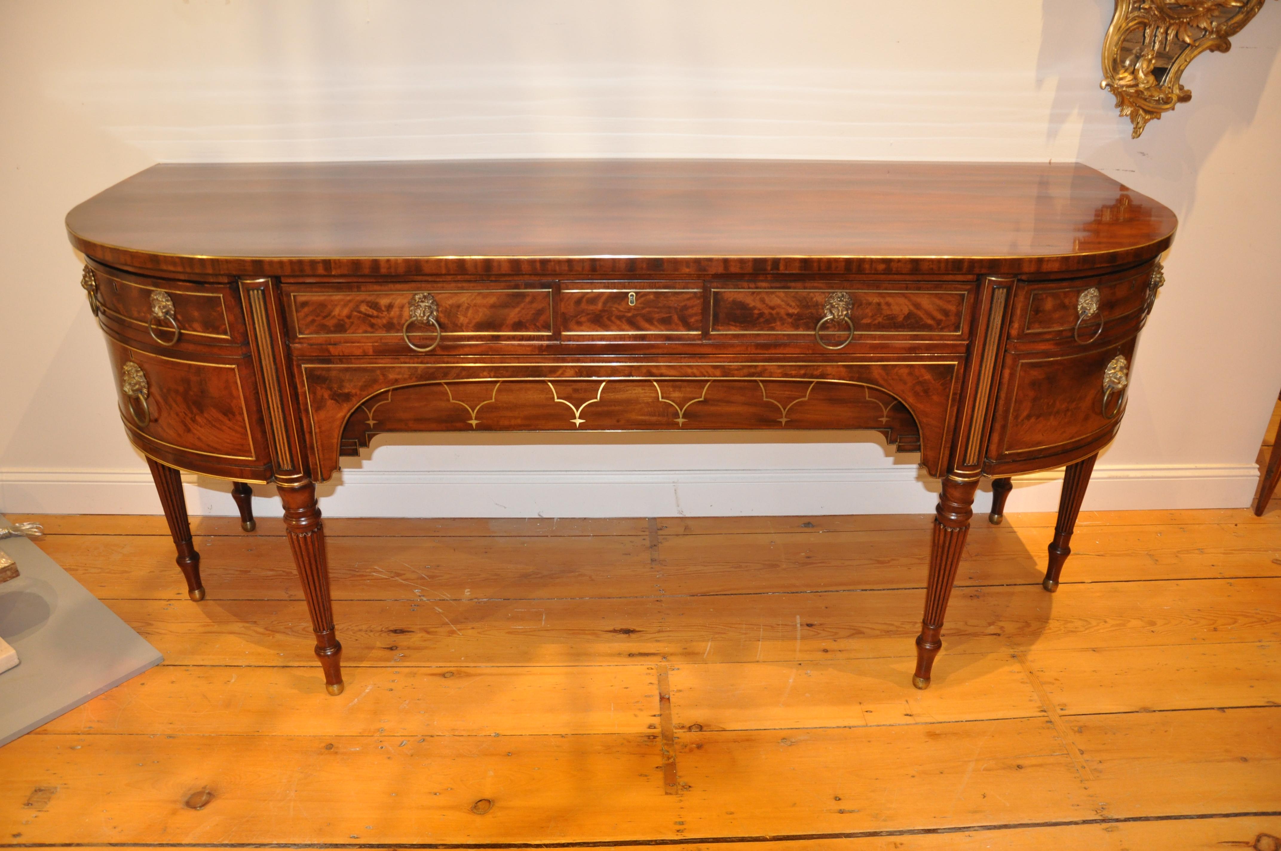 Exquisite English Regency brass banded mahogany sideboard of the finest quality. Probably Gillows. With internal Wine 