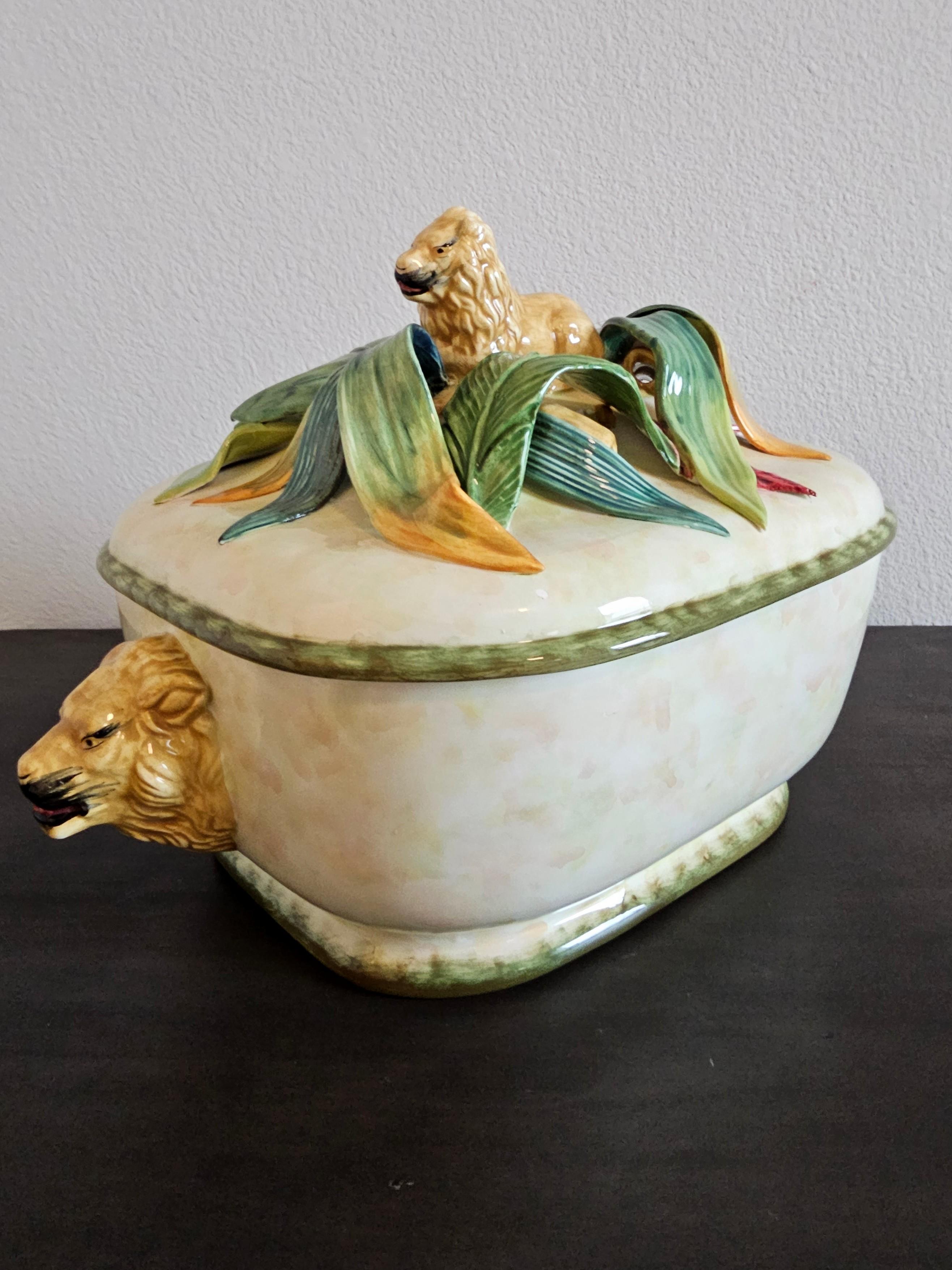 A scarce fine quality antique English Staffordshire pottery majolica tureen covered serving dish. 

Having a fitted lid surmounted with figural reclining lion finial with hand painted detailing, atop intricate polychrome glazed sculptural fiolate