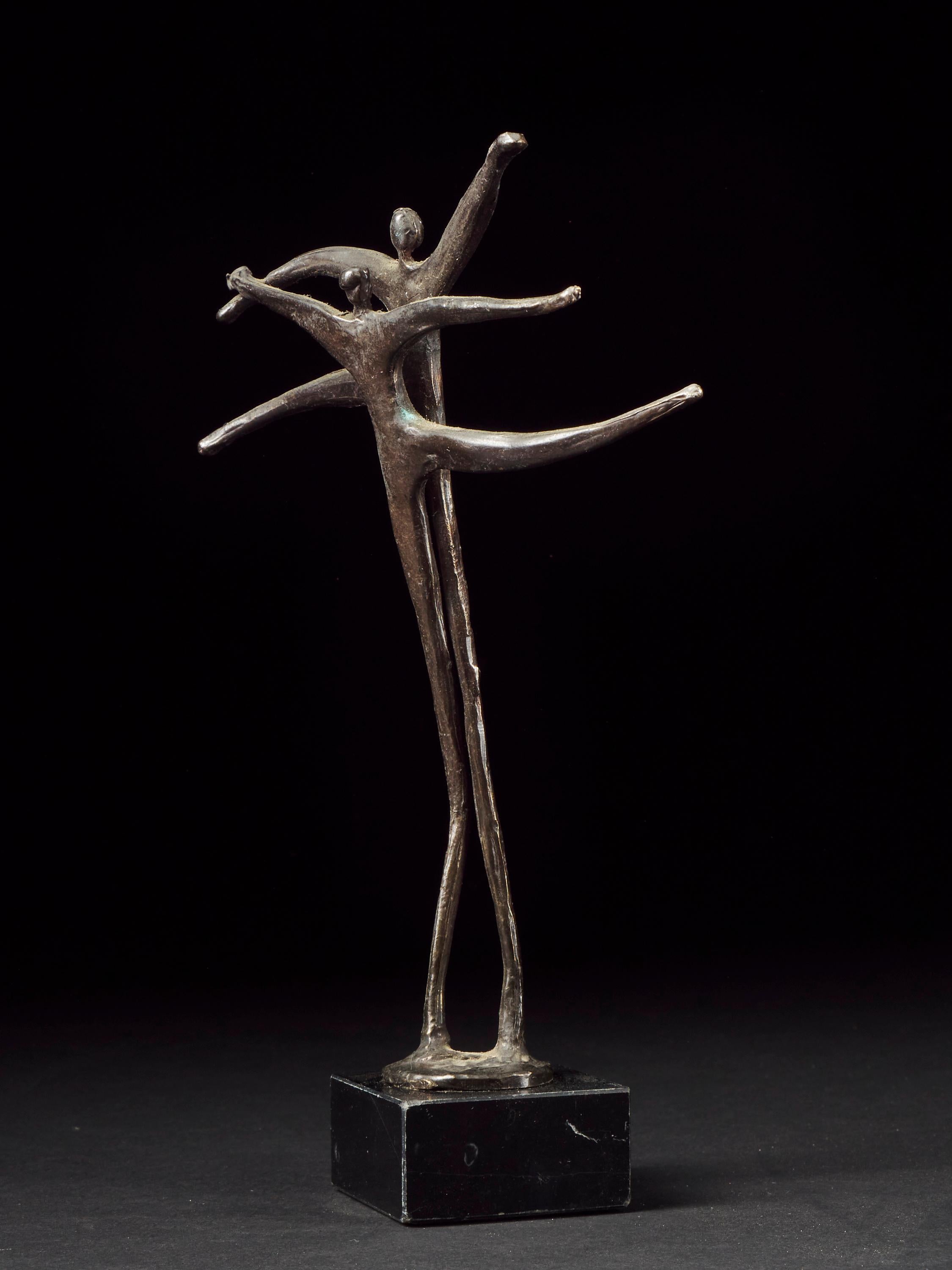 Rare curiosity for collectors with refined design. This artwork displays delicate features of two entangled bodies becoming one statue. An allegory made of copper alloy on a stone base.