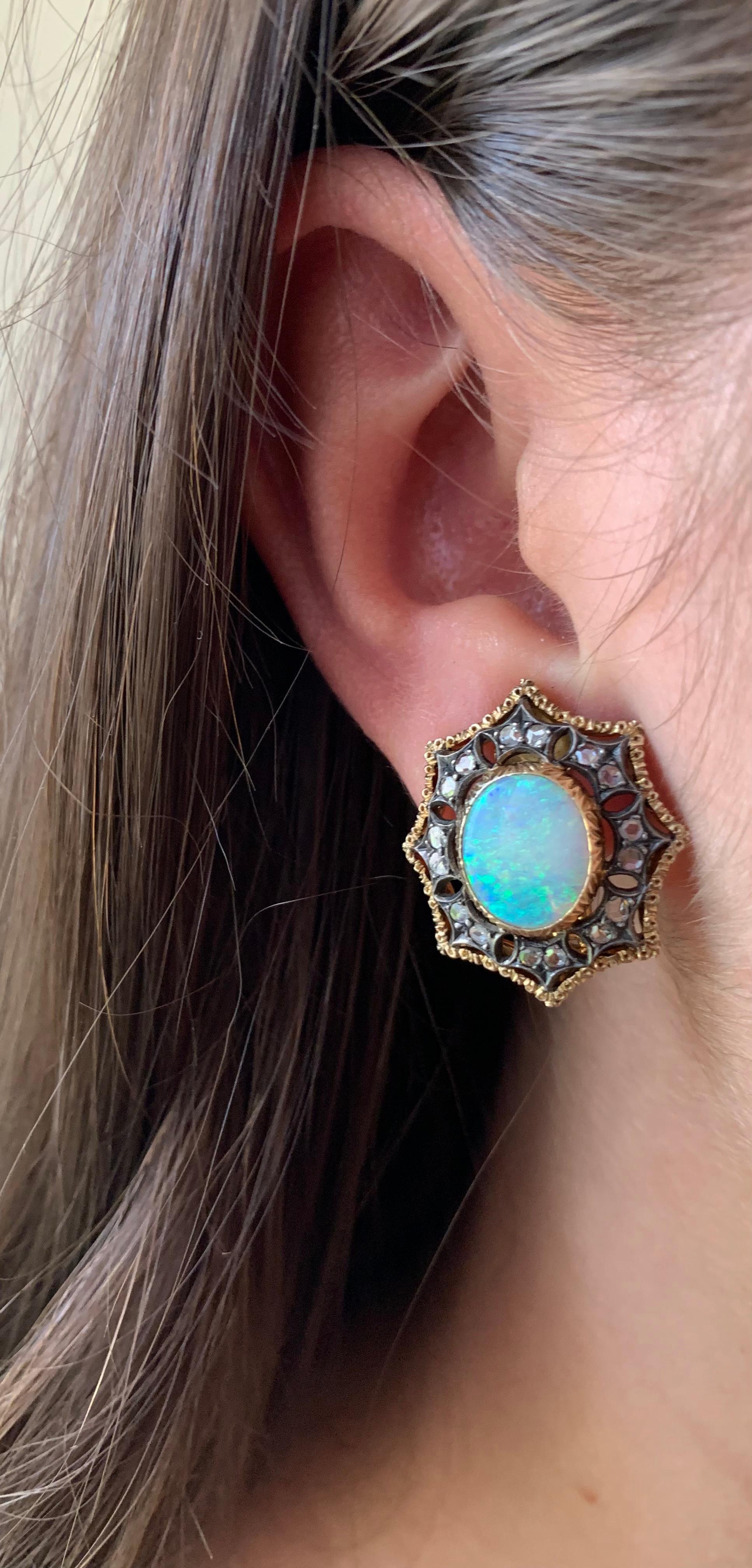 Stunning and substantial estate Mario Buccellati cabochon opal diamond 18K yellow and patinated white gold earrings
20th Century
Original Buccellati octagonal burgundy leather velvet lined box
The large central 11mm by 9.5mm oval cabochon opals