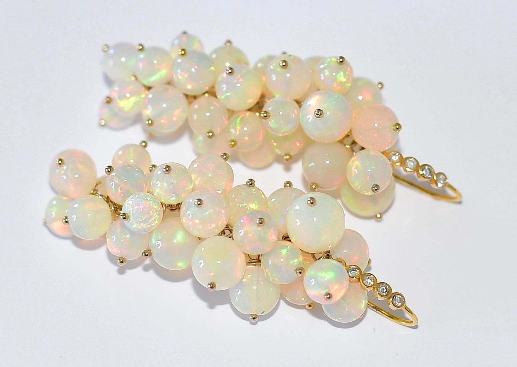 Wonderful, unique, and like a bunch of white juicy berries! High-end White Ethiopian Opal with a wonderful play of color, extremely rare round shape, and large sizes! (4.8.9mm) approx. 74 carats! Earwire Metal: 14K Solid Yellow Gold
Extraordinary
