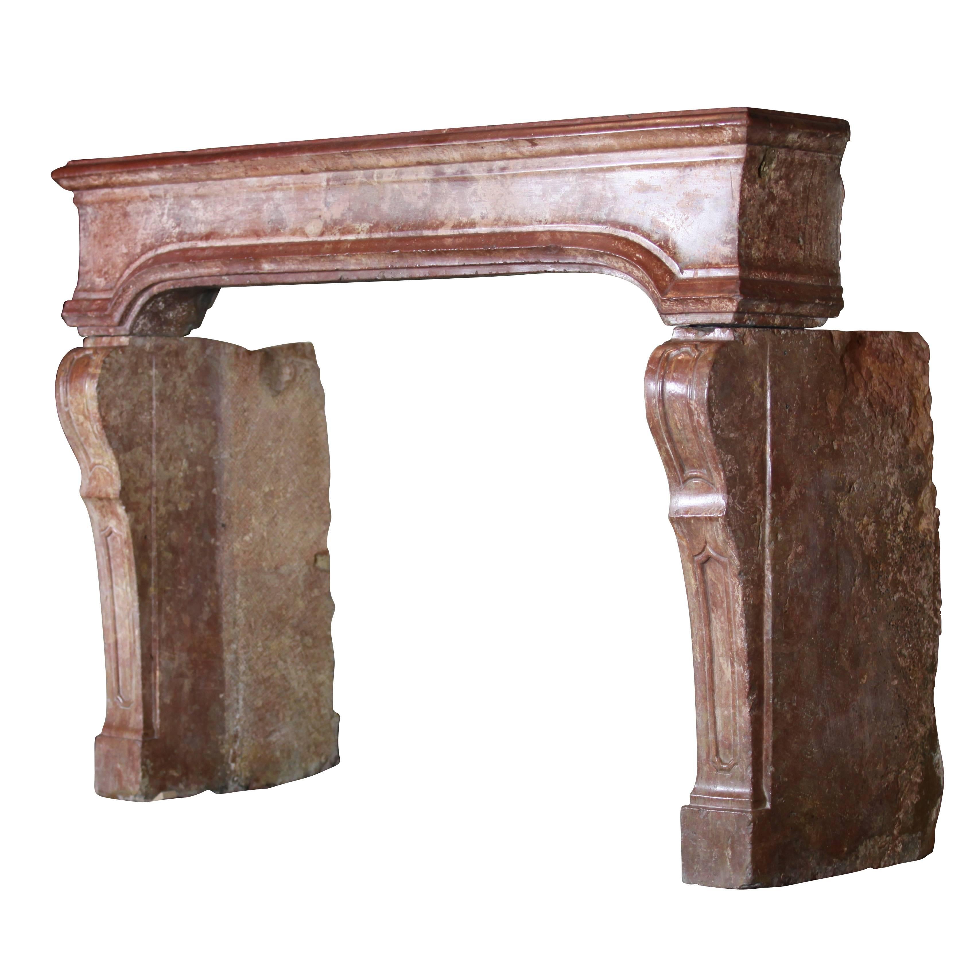 This fireplace surround is a real treasure. It is an Italian chimney piece from the Veneto region in Italy. It has a great patina and perfect proportions. It is a one of a kind. The small proportions of this piece and the deep color of it makes it
