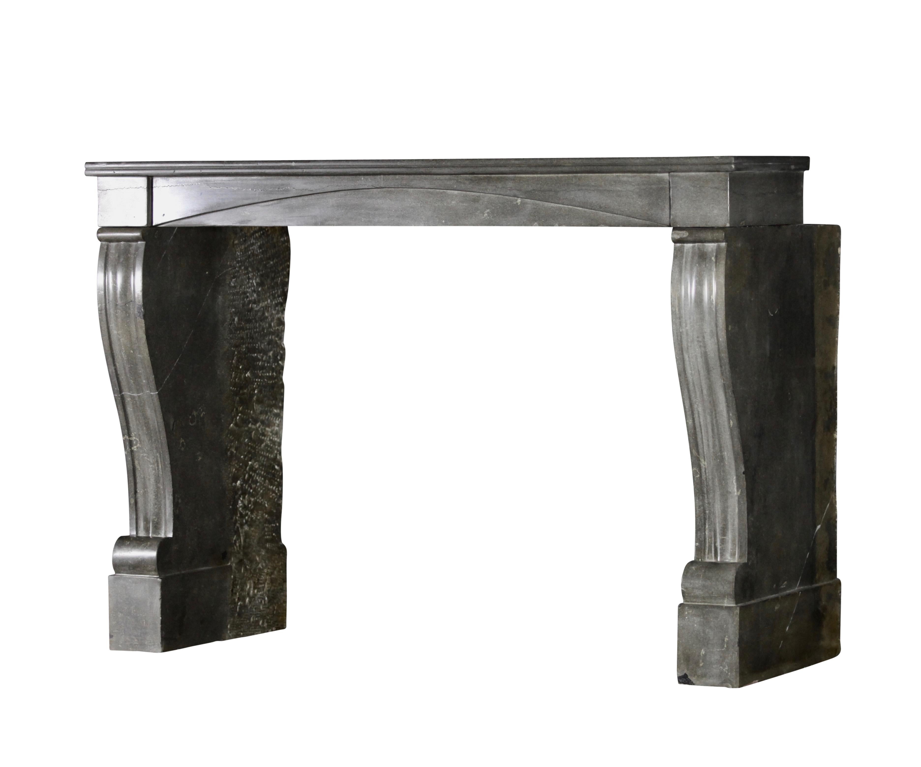 This is a very nice grey-green, marble stone original antique fireplace mantel. The design of it fits it in timeless and contemporary interiors as well Art Deco ones.
The polished stone reflects the light of the room.
Measures:
143 cm Exterior Width