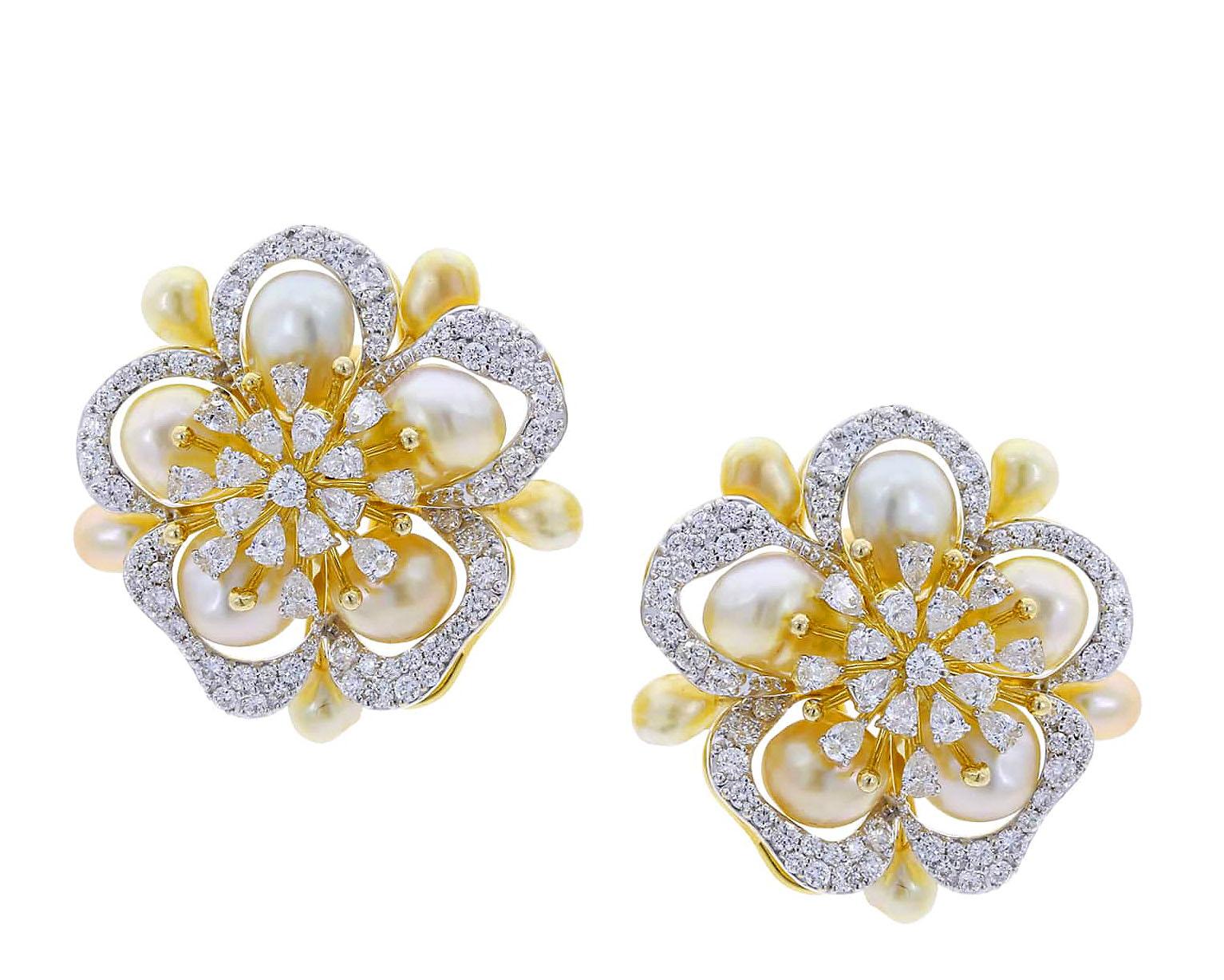 A classic pair of floral earrings set with combinations of two most elegant jewels: pearls and diamonds. The pearls weigh appx. 30 cts. and the diamonds (mix of rounds and pears) are 3.45 cts. Set in 18K Yellow Gold. Part of D'Deco's INFUSION