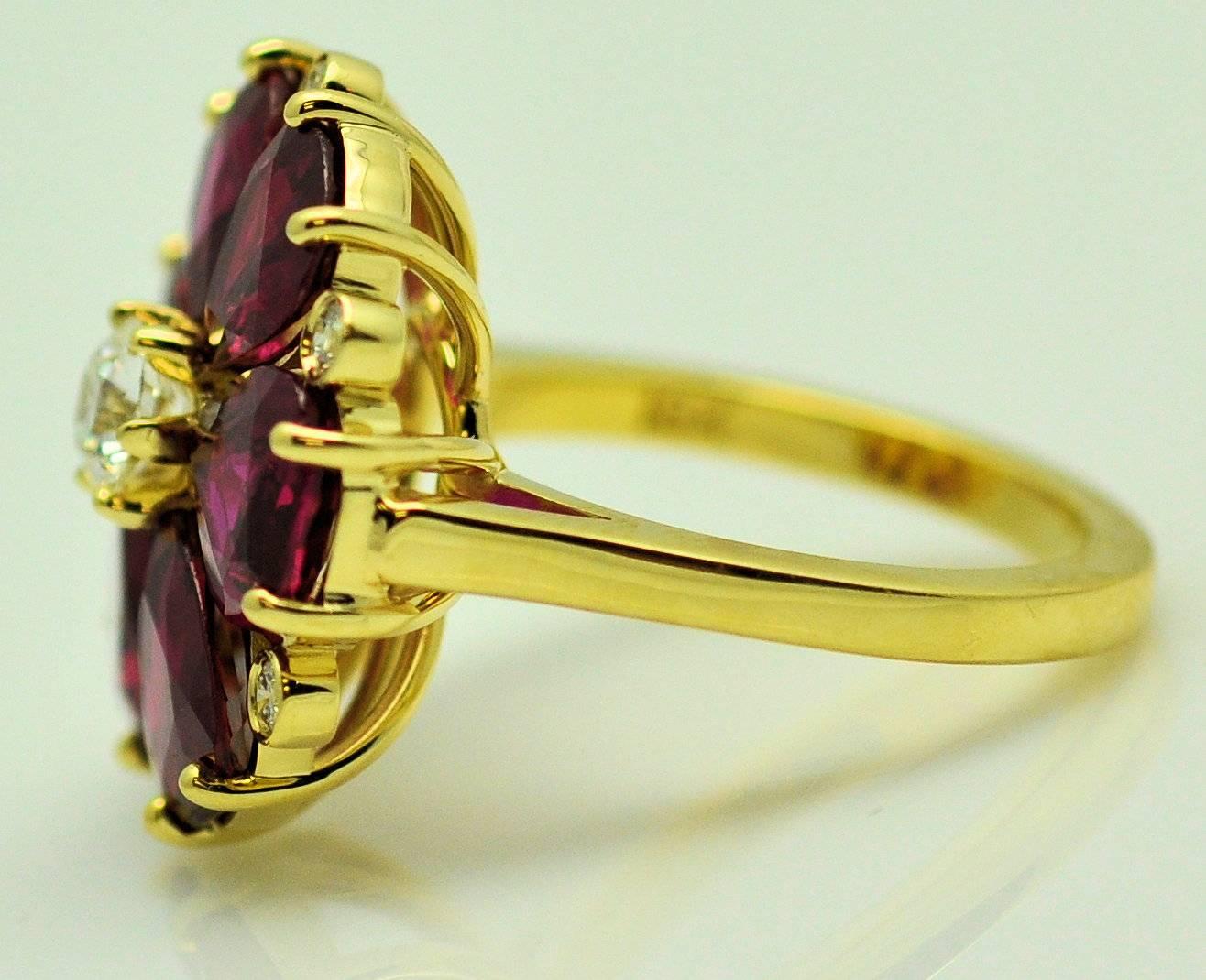 18Karat yellow gold custom handmade dinner ring with previously owned 6 pear shape rubies weighing a total of 7.52 carats with Stone Lab Group gem report for all.  These are older Thai rubies, heated.  Very fine, rich red with slight violet, bright,