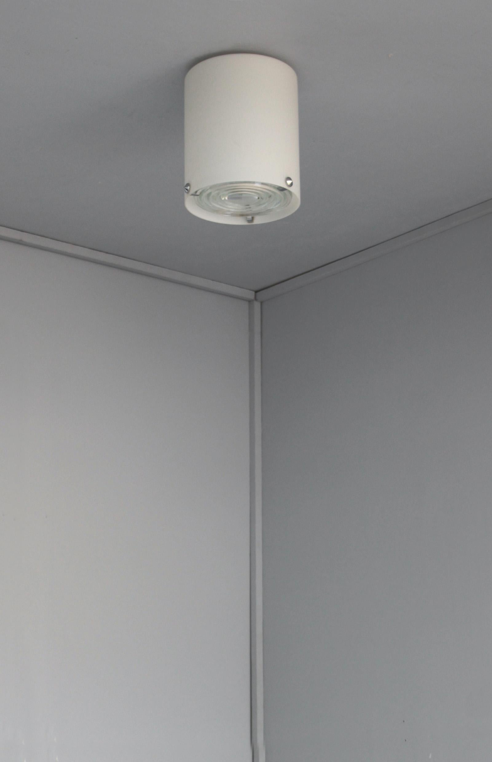 Jean Perzel - A fine French Mid-Century cylinder-shaped flush mount / ceiling light in enameled glass with three chrome studs that support a prismatic glass lens (holophane).
