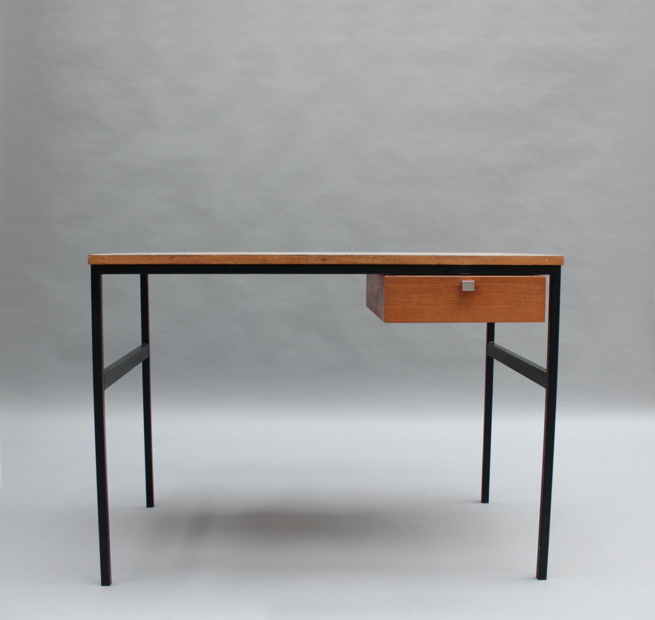 Pierre Paulin (1927-2009) - A fine French Mid-Century writing table with a black lacquered tubular metal base, a white laminated plywood top and a wooden drawer with a metal pull. Model CM 217, Edition Thonet 1962