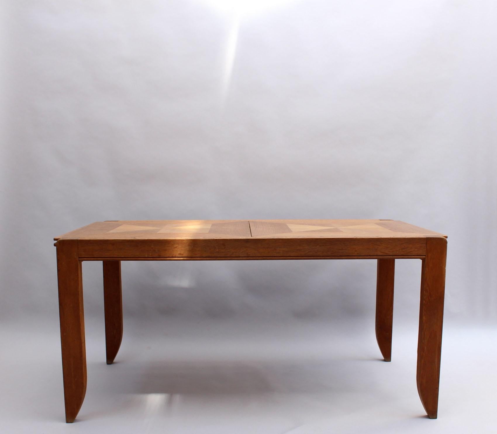 Robert Guillerme (1913-1990) and Jacques Chambron (1914-2001) : 
A fine French mid-century solid oak extendable dining/writing table.
Length with the two center leaves is 82 5/8