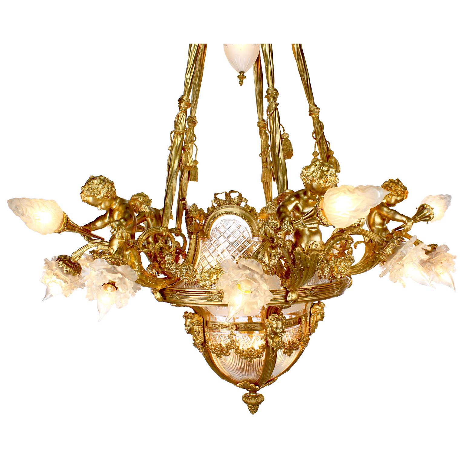 A very fine and palatial French 19th-20th century Louis XV style gilt bronze (Ormolu) and fitted-Baccarat crystal (cut-glass) twenty-six-light figural chandelier with five large cherubs, each holding a frosted glass torch and surmounted with two
