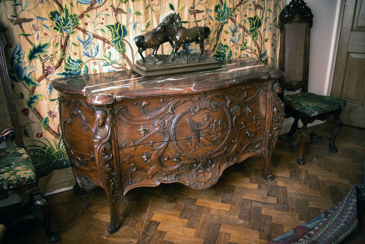 A fine and rare French mid-19th century carved bombé commode retaining its substantial original Rouge Royale serpentine-marble top.

This exceptional French bombé commode – sometimes described as ‘galbée en tombeau’ – has all the hallmarks of a