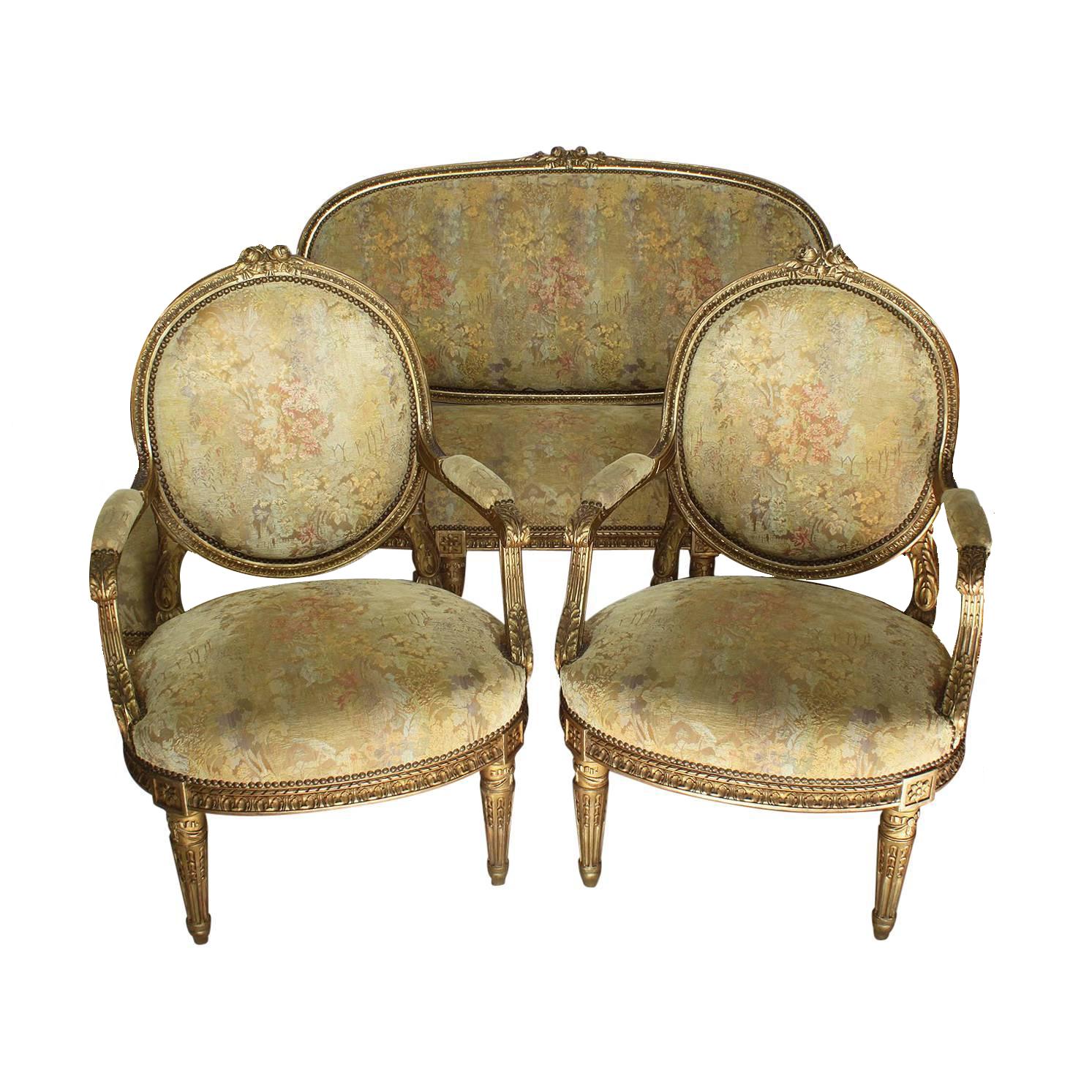 A very fine French 19th century Louis XVI Style giltwood carved three-piece salon suite, comprising of a canapé and four fauteuils, all with recent upholstery. The finely carved frames with paneled back, padded arm supports and seats, with ribbon