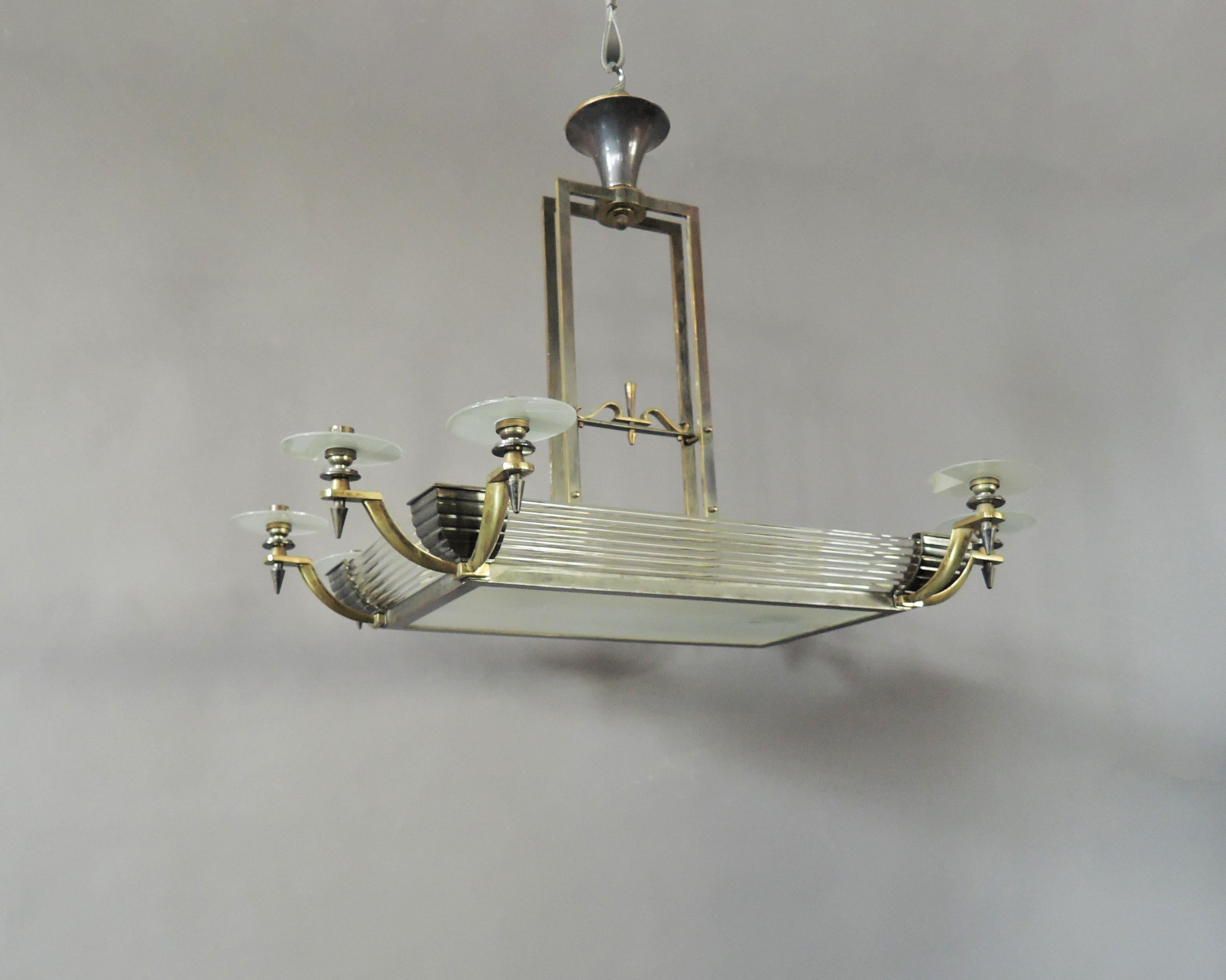 Maison Petitot - A fine French Art Deco brass and gun metal framed chandelier with glass rods, frosted glass shades and bottom diffuser with hand cut details.