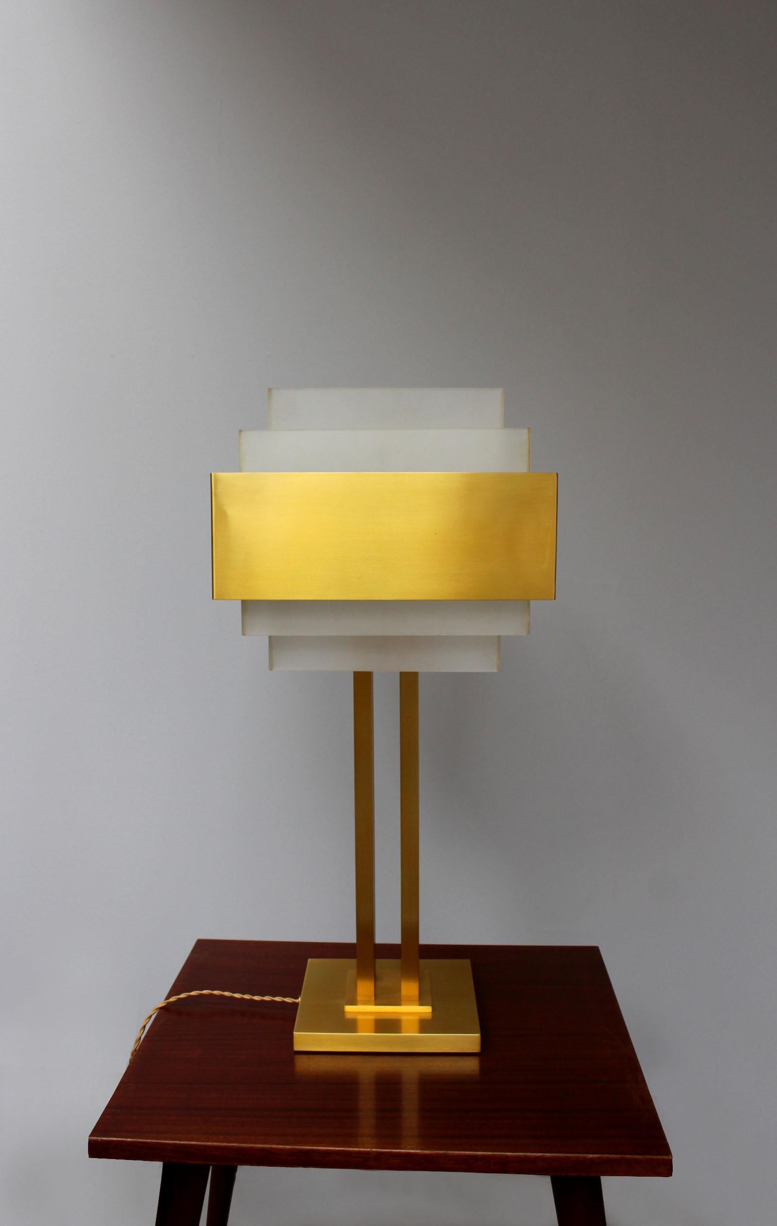Jean Perzel - A fine French architectural table lamp with a bronze base that supports the glass shades.