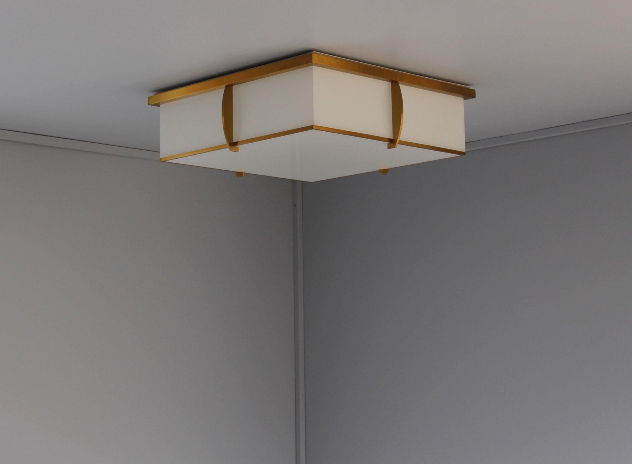 Mounted on a gold lacquered bronze square shaped frame that holds the white laminated glass diffusers.
The flat square horizontal diffuser is easily removable in order to change the bulbs.
    