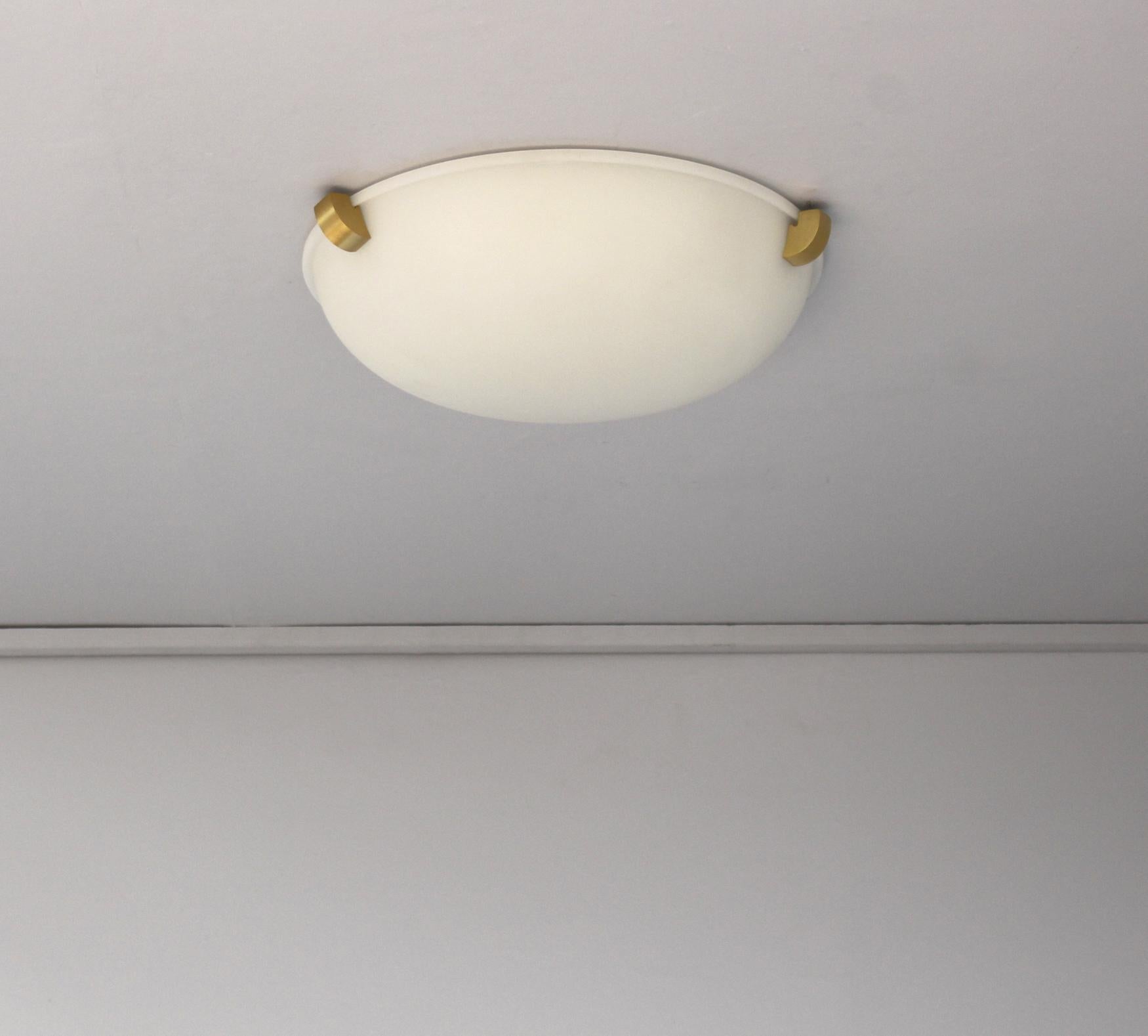 Jean Perzel - A fine French Art Deco flush mount ceiling fixtures or wall light with a round fluted frosted glass shade supported by three bronze studs.