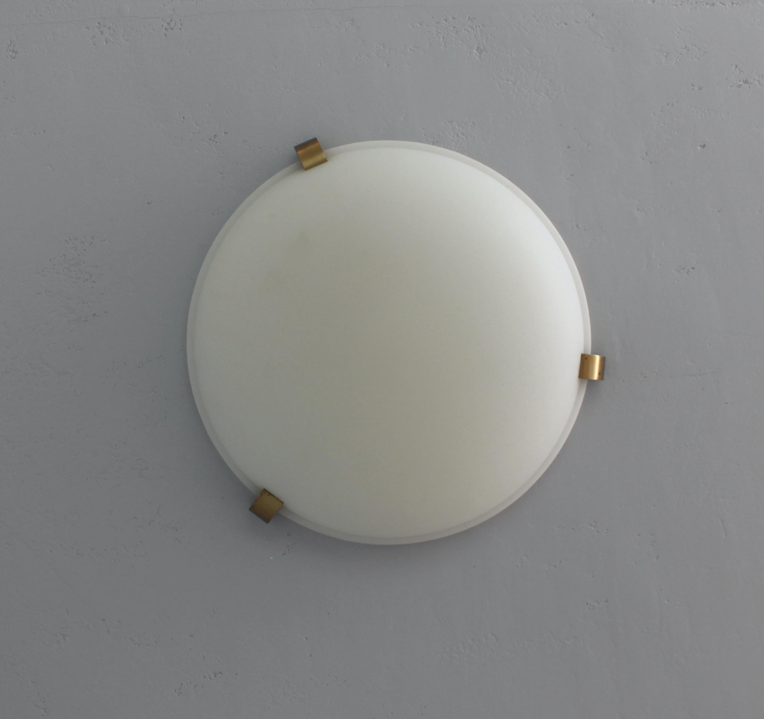 Jean Perzel - A fine French Art Deco flush mount ceiling fixtures or wall light with a round fluted and frosted glass shade supported by three bronze studs.
Signed