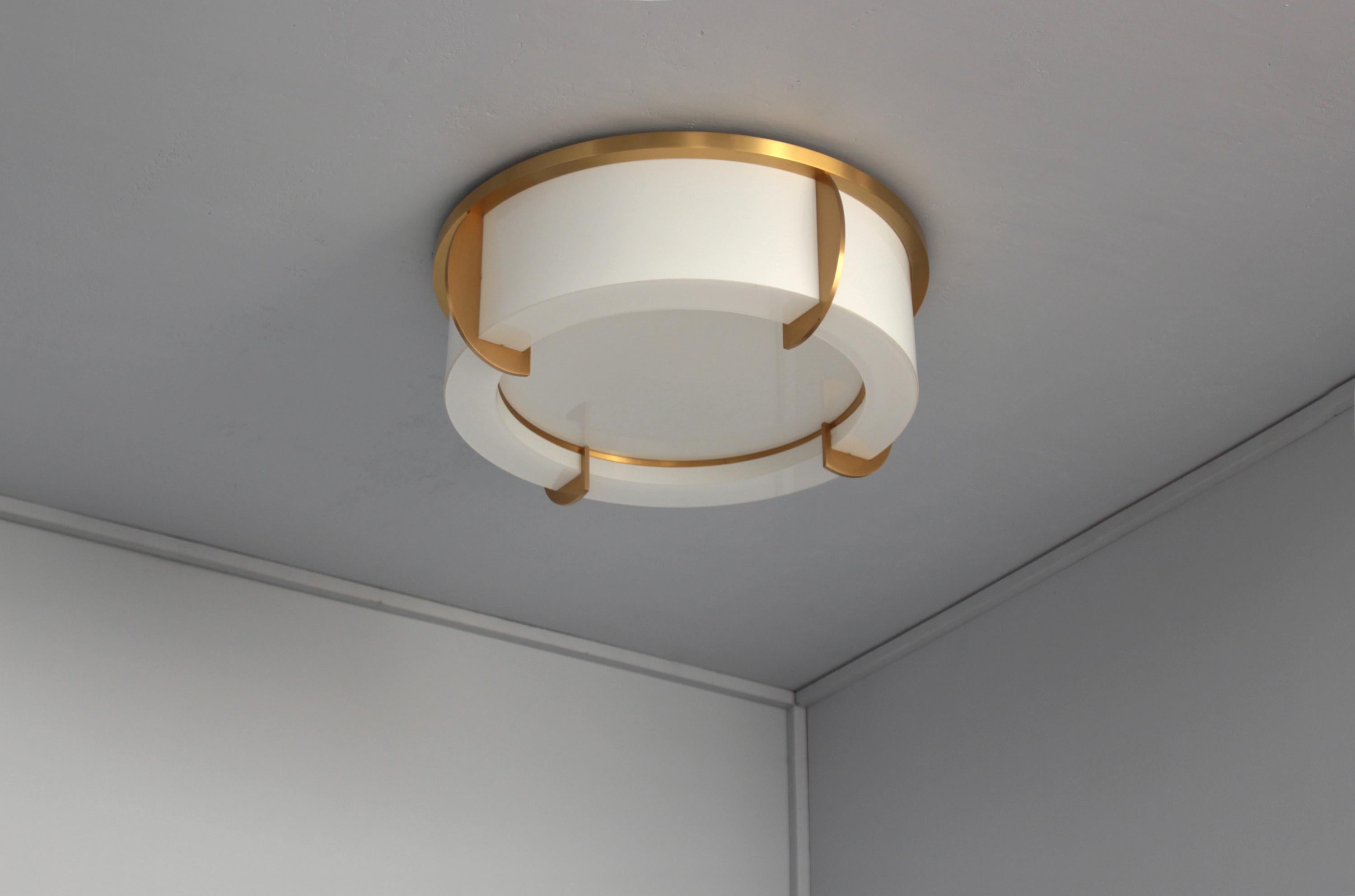 Atelier Jean Perzel - A fine French ceiling fixture mounted on a bronze crown-shaped frame that holds the white enameled glass diffusers. The bottom round enameled diffuser is removable in order to change the bulbs.

 