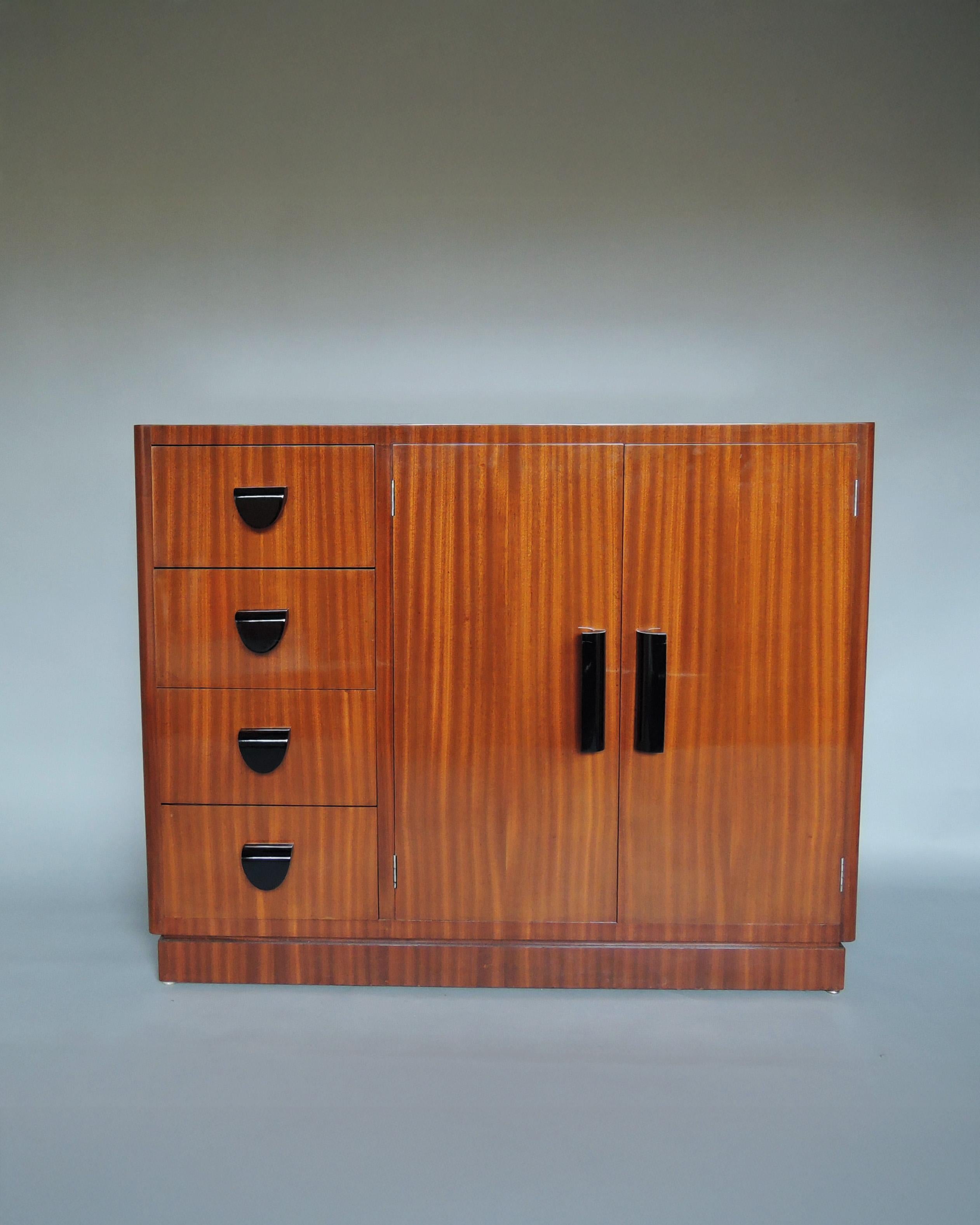Pierre LAHALLE & Georges LEVARD - A fine French Art Deco mahogany 2 doors and 4 drawers (with optional compartments) buffet/cabinet with black lacquered wooden pulls. 
Signed.
