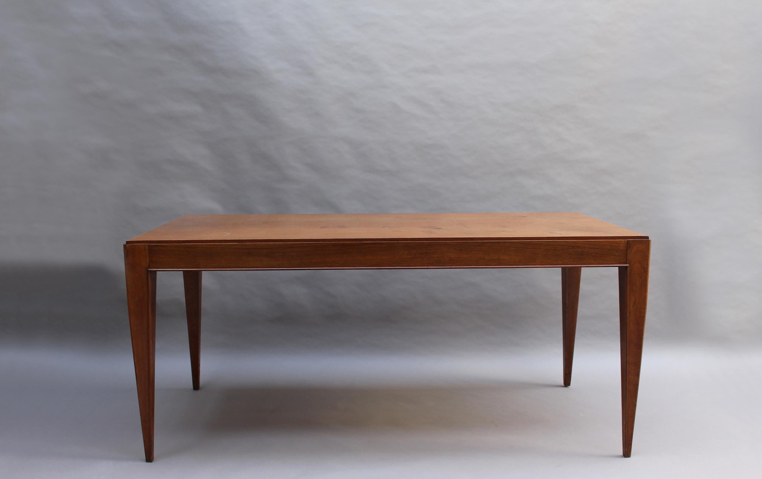 A fine French Art Deco rectangular palisander dining or writing table attributed to Dominique (André Domin & Marcel Genevrière) 
Provenance: Lazard bank in Paris.