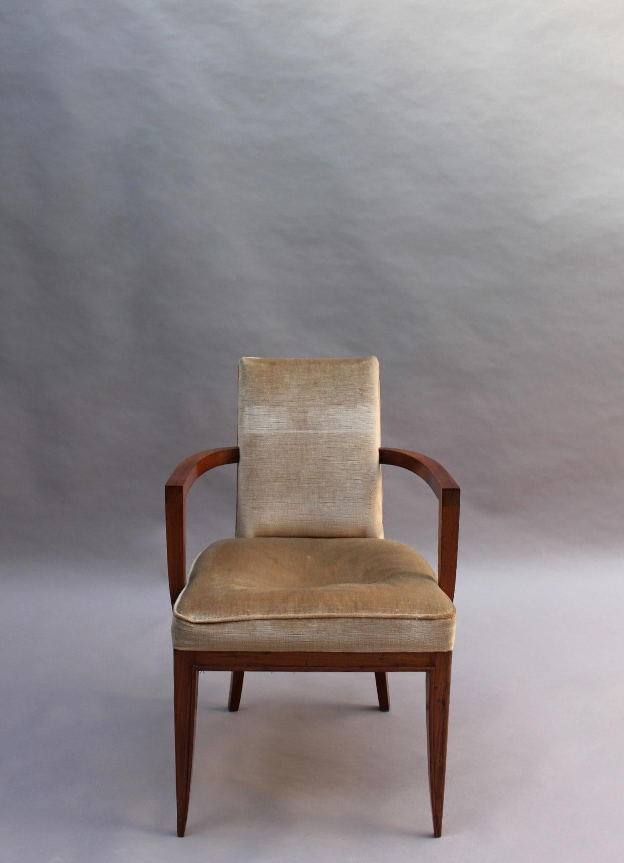 Maxime Old (1910-1991): A fine French Art Deco rosewood armchair with a flat molding highlighting the shape of the frame.
Measure: Arm height is 25.75 in.
 