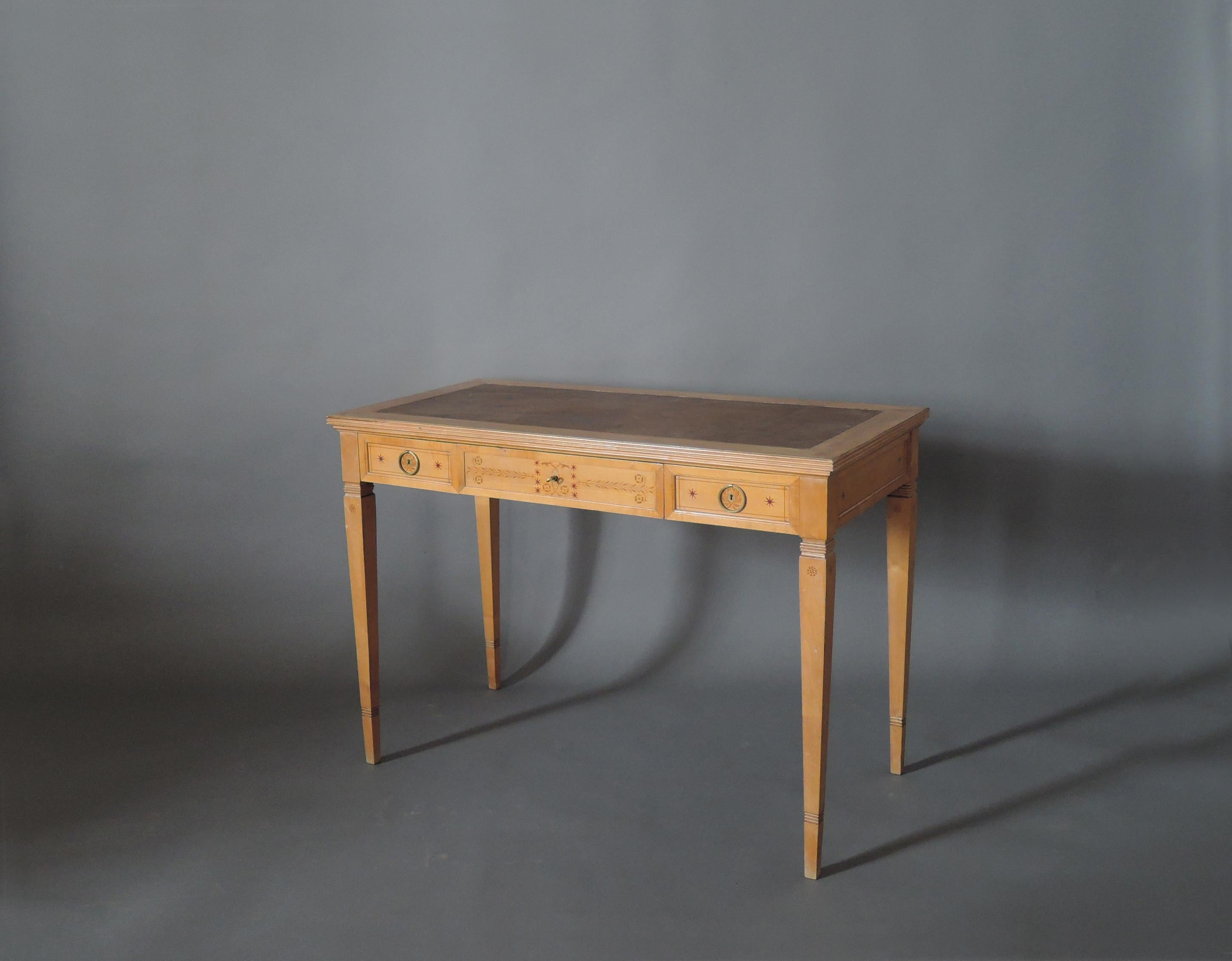 In sycamore, with three drawers, refined gilded bronze handles, floral stencil details and original leather top. 
Signed R. Damon & Bertaux, Paris - on desk and the two matching chairs (not included in price).