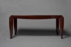 A Fine French Art Deco Mahogany Dining Table in the manner of Jean Pascaud