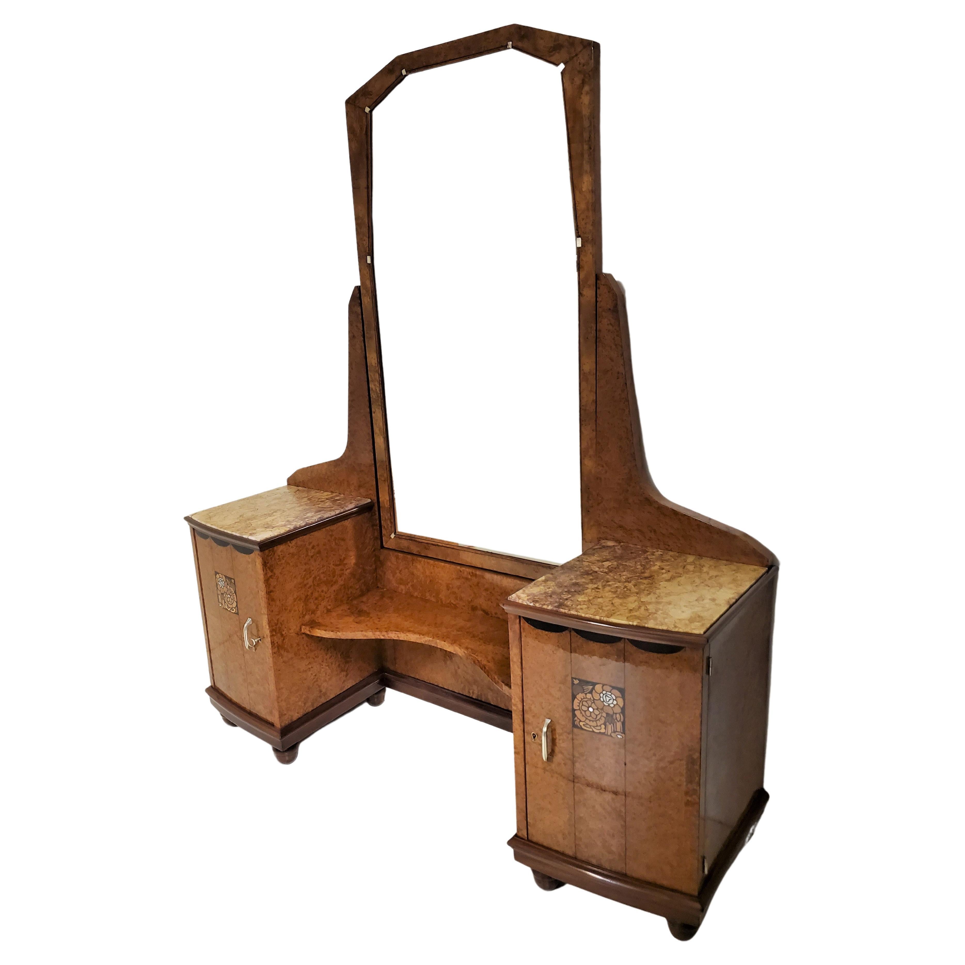  Important and spectacular French Art Deco vanity in beautifully figured thuya wood, attributed to Maurice Dufrène.
Created in full burl wood with marquetry inlay, this vanity has the original beveled
 cheval mirror that slightly swivels, along with