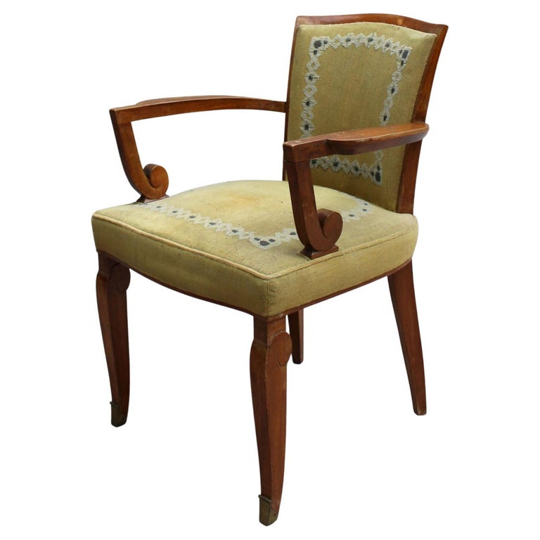 Jules Leleu: A fine French Art Deco walnut armchair with bronze sabots.
Original Aubusson tapestry (in vintage condition).