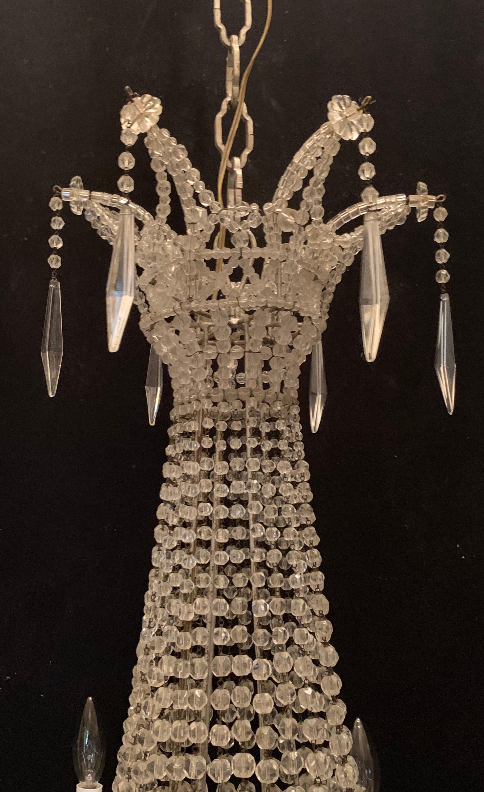 A fine French beaded crystal basket form, lattice and cascading swag large chandelier with 6 candelabra lights.