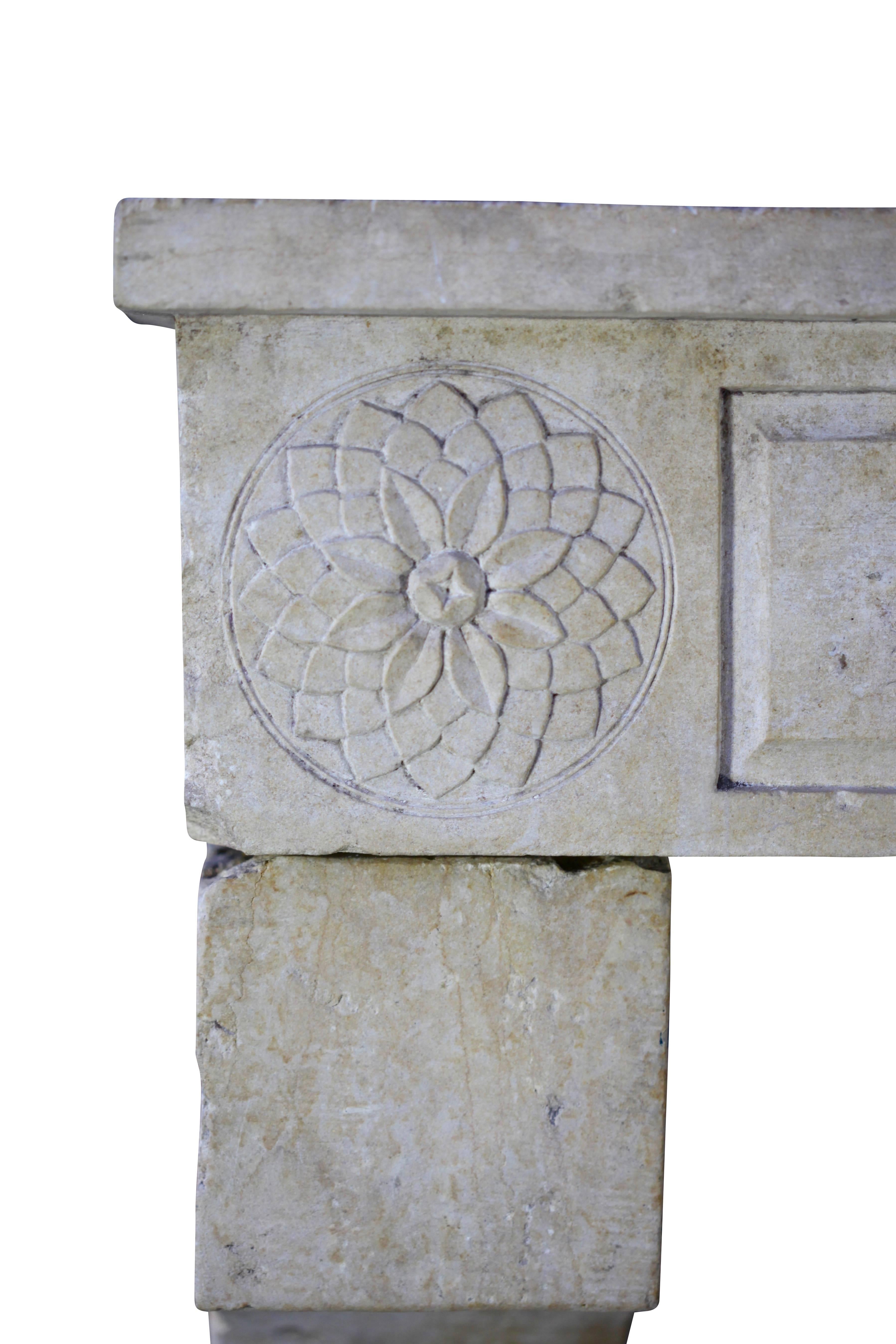 Unusual limestone fireplace surround with remains of the old patina. The front has an Geometric Italian influence design. See the details of the refined carving. 
Measures: 131 cm EW 51.57