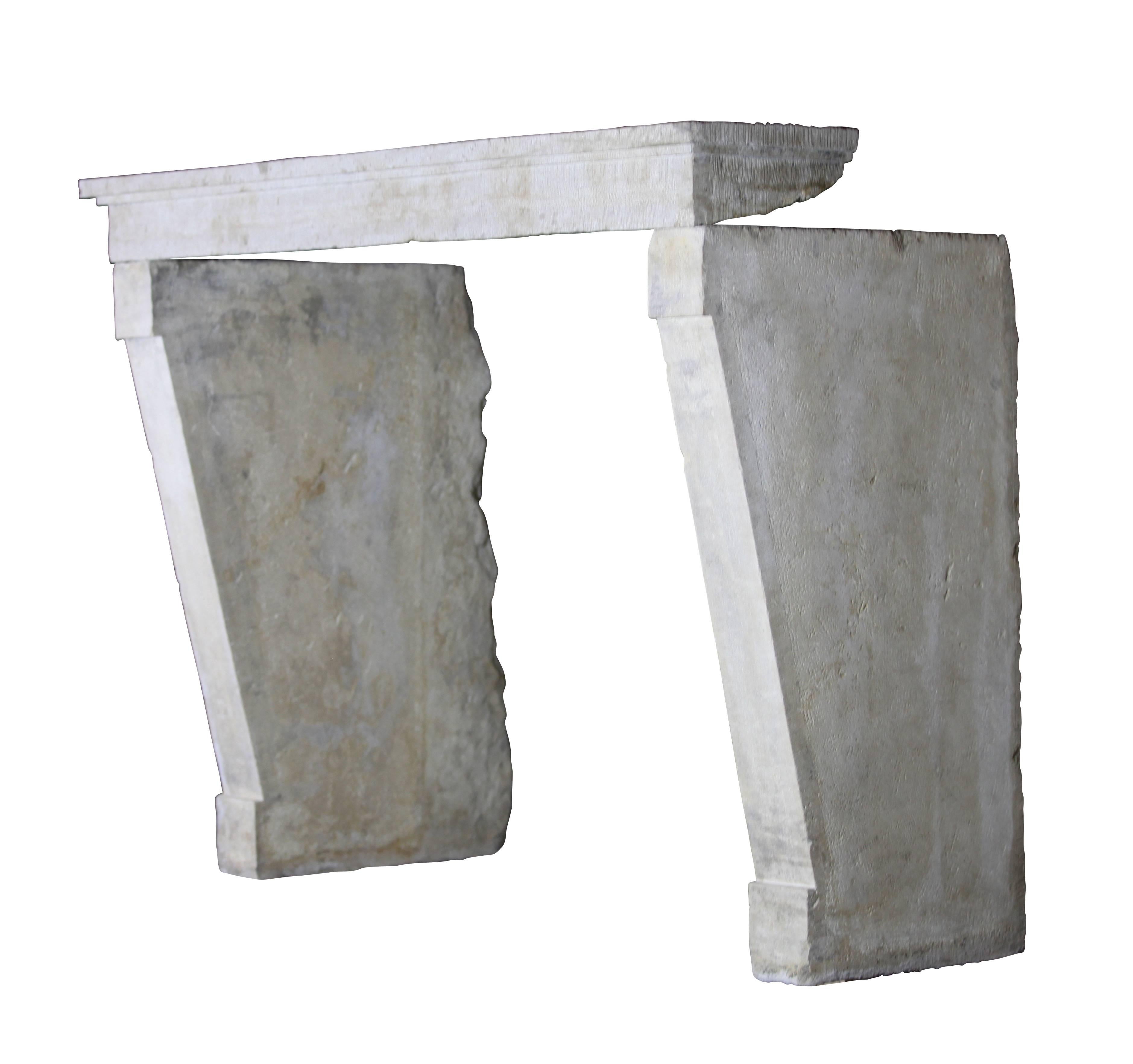 This French country original antique fireplace mantle with the straight lines matches many contemporary country chique interior design concepts. The jambs are going slightly backwards. A mantel as you find in the dining room of Chateau de