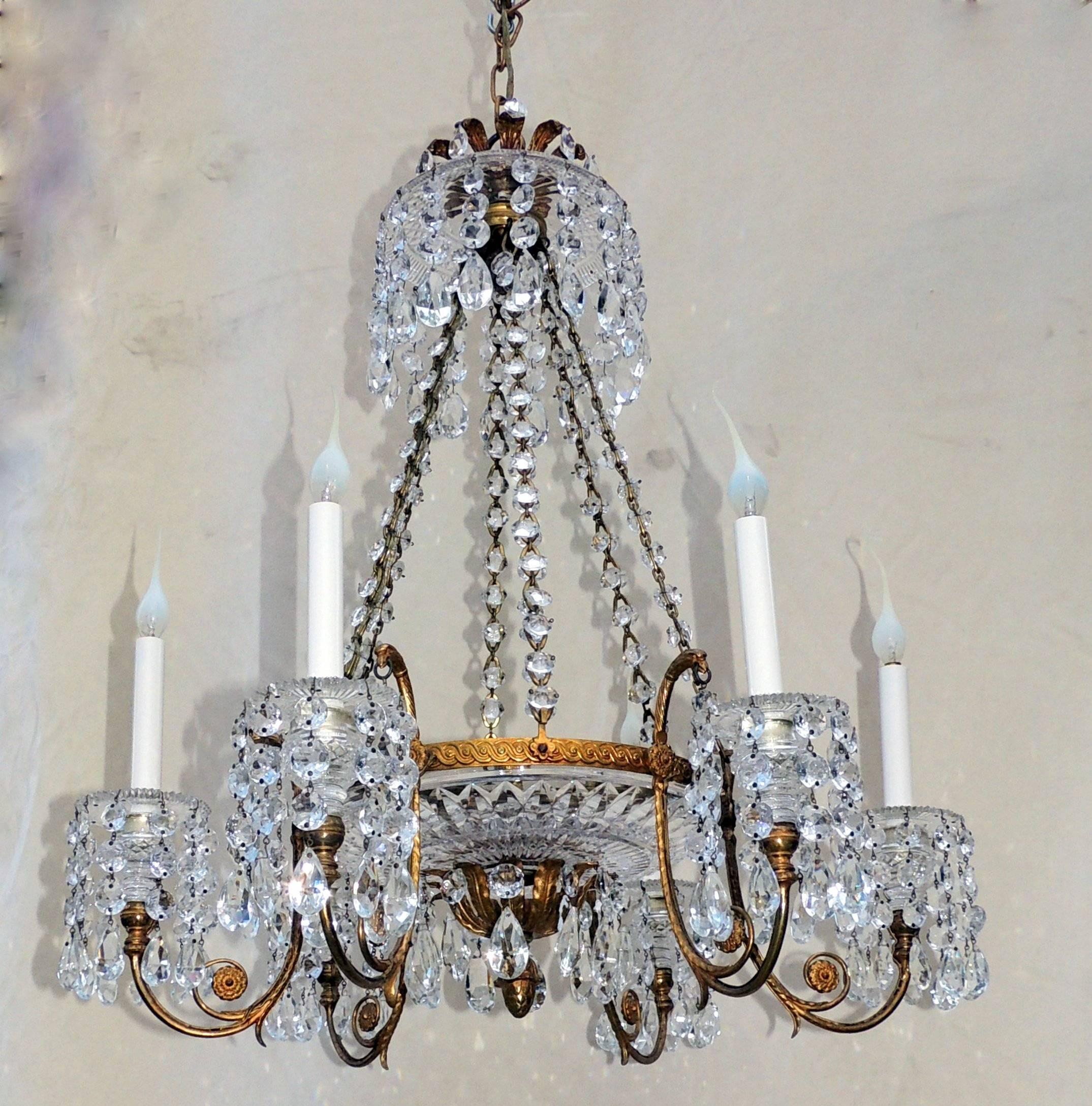 Doré bronze six-light and cut crystal bowl neoclassical chandelier with crystal chain. A timeless design of crystal bobeches with cascading crystal prism drops, intricate cut crystal bowls, beautiful doré bronze arms and frame finished with