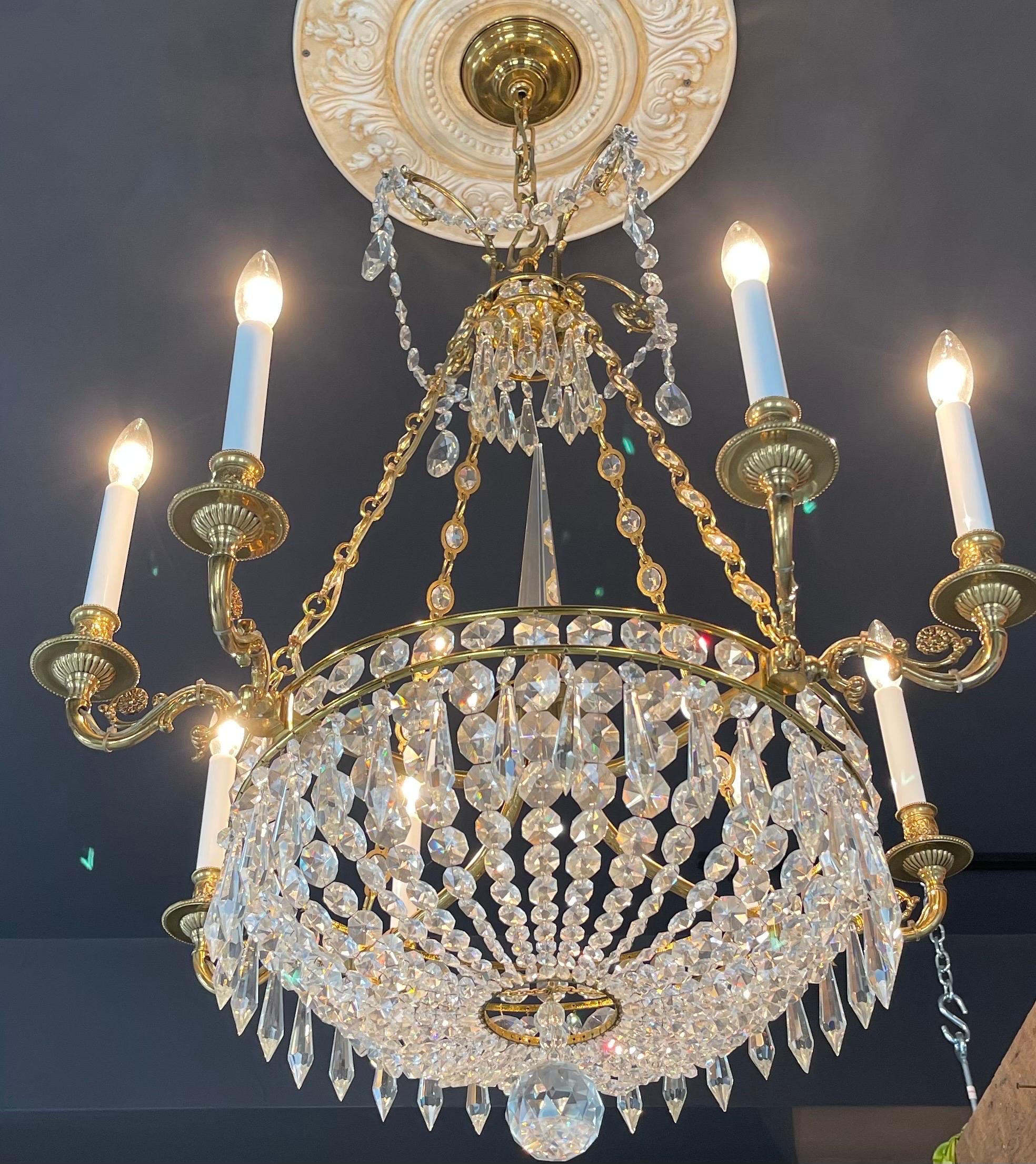 A fine French empire neoclassical Regency dore bronze crystal basket chandelier with 8 candelabra arms.
 