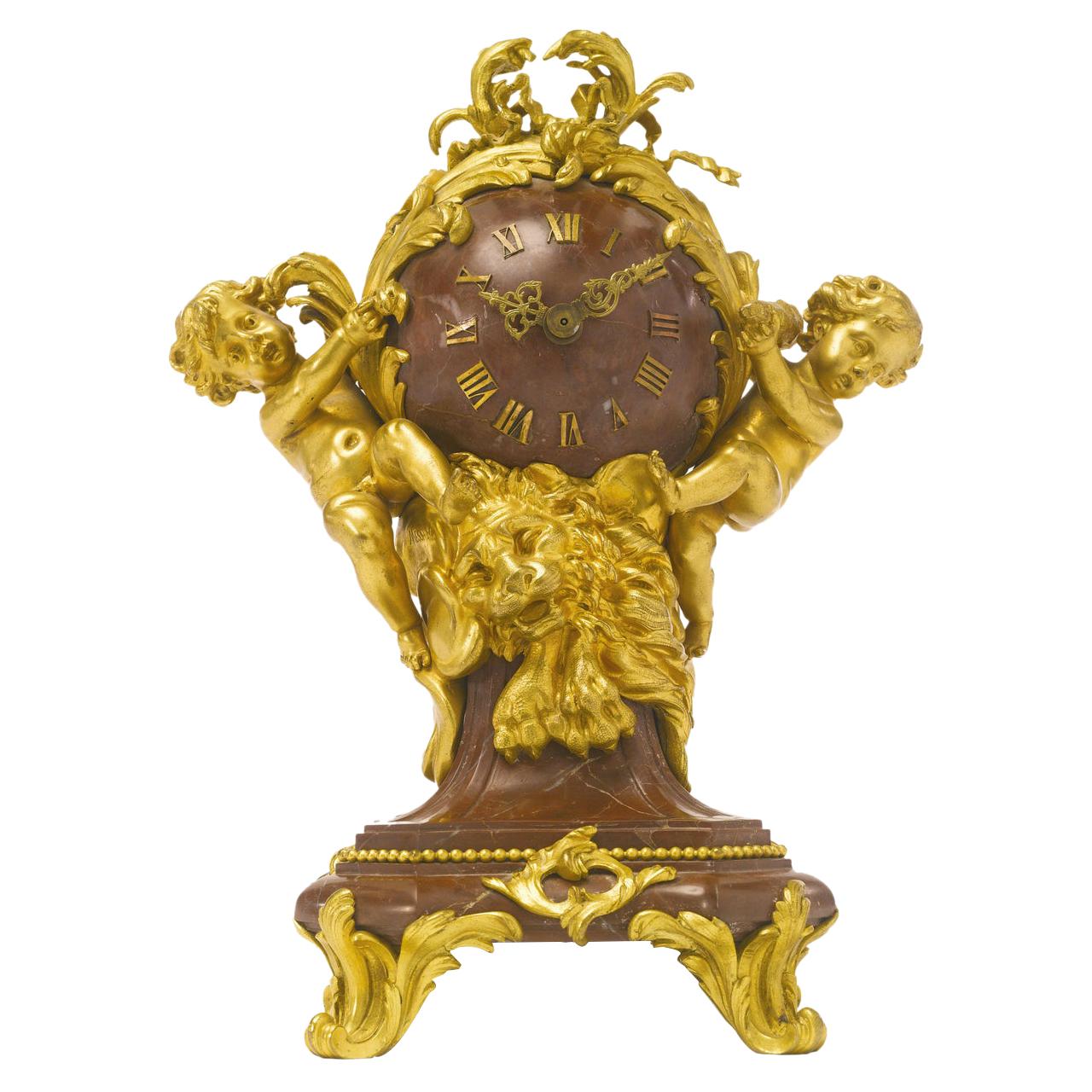 Pendule de table française en bronze doré et griotte de Campan rouge par Lon Messag en vente