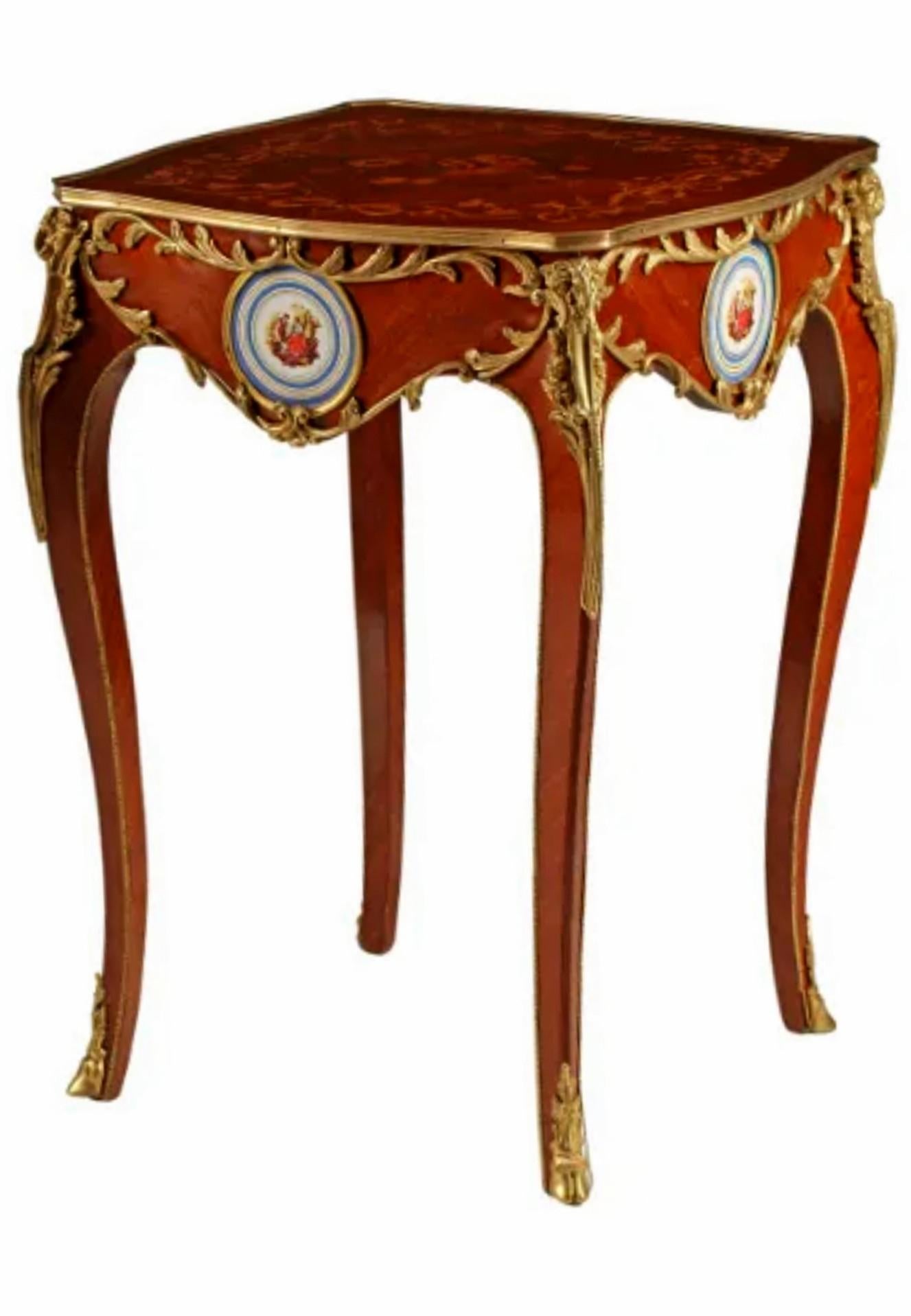 A fine quality pair of vintage French Louis XV style kingwood floral marquetry bronze doré and porcelain mounted tables. Francois Linke (1855-1946) taste, in the manner of famous Parisian ébéniste Martin Carlin (1730–1785), having a square top with