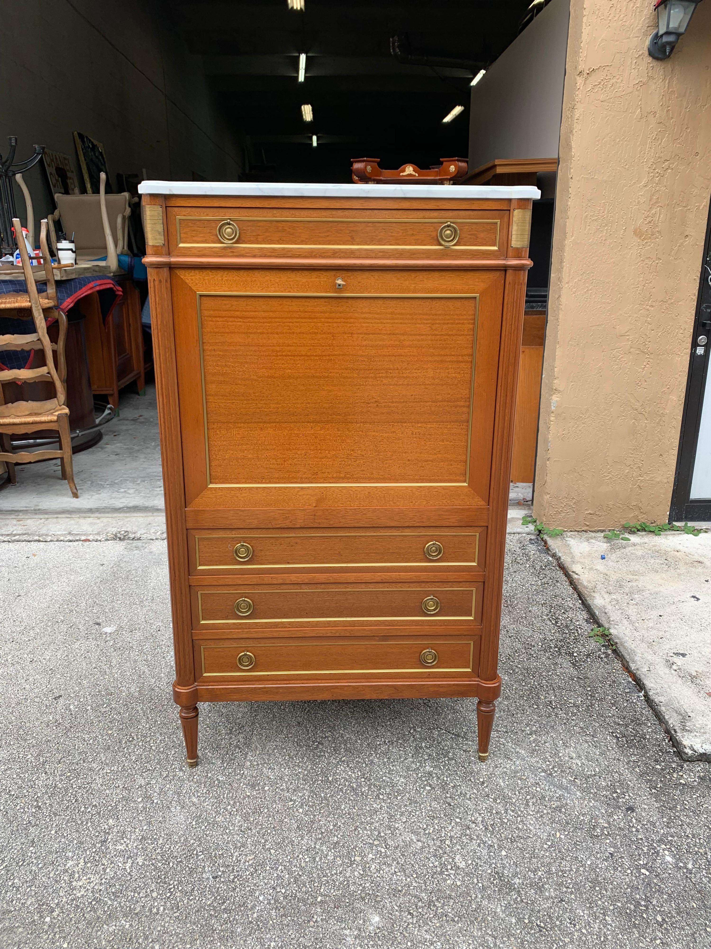 Fine antique mahogany “Secrétaires”, the mahogany wood has been finished with a French polished high luster inside and outside, Carrara marble top, and gilded trims throughout. This Louis XVI style French antique secretary desk has 4 dovetailed