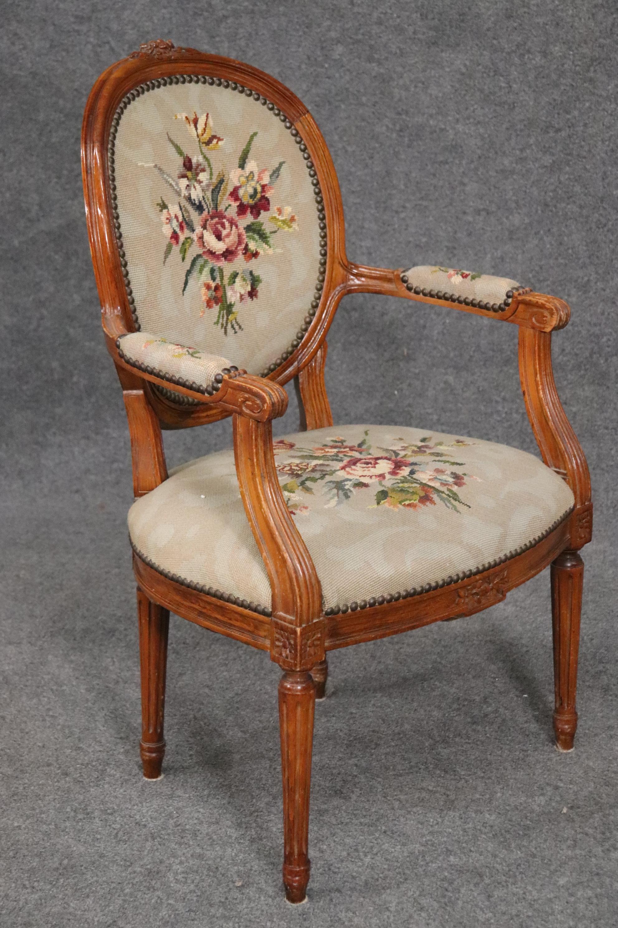 This is a beautiful chair that's perfect for a desk or vanity. The chair is in good condition and has a beautiful needlepoint upholstery. The chair measures 36 tall x 22 wide x 21 deep and the seat height is 17 inches. Dates to the 1940s.
