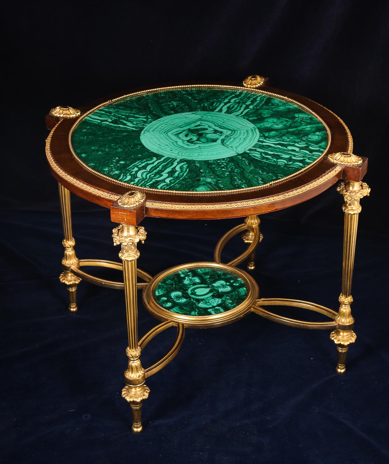 A fine circular form French Louis XVI style gilt bronze, wood and malachite coffee or side table.