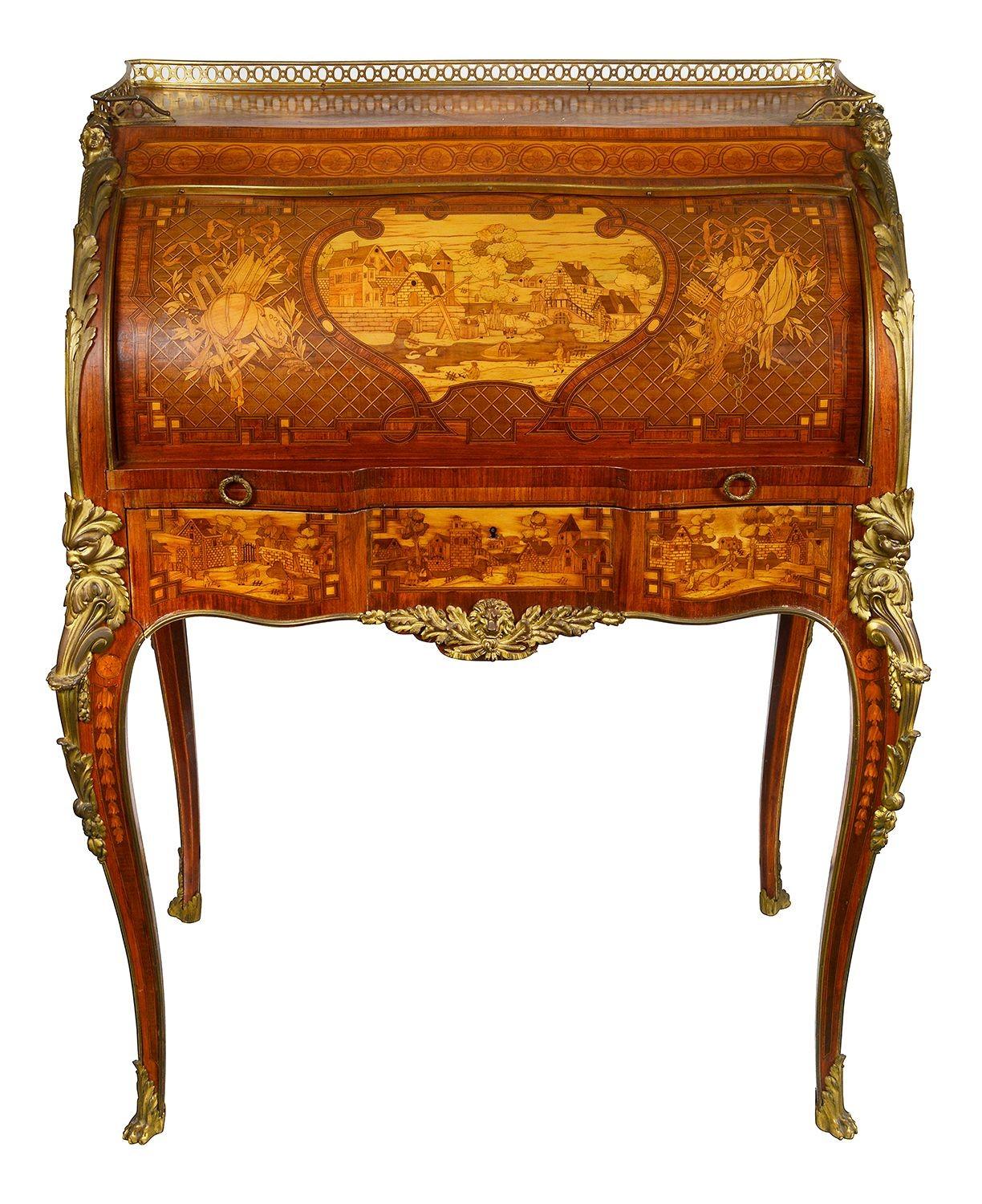 This exquisite 19th-century French marquetry bureau showcases exceptional craftsmanship and artistry. Adorned with intricate floral and landscape motifs, the bureau features a rich, polished wood veneer that enhances its elegance. The fitted