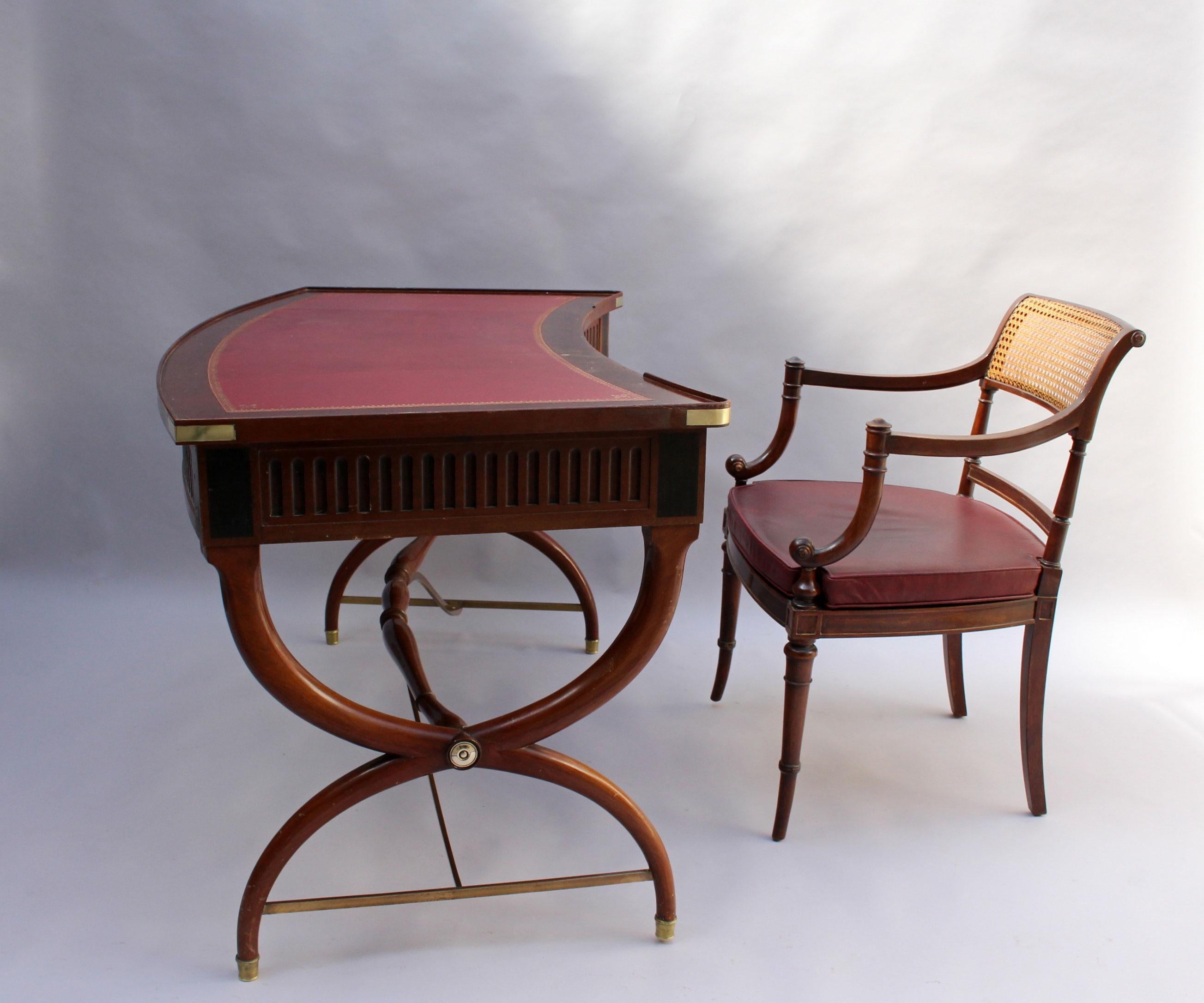 A fine French Art Deco neoclassical mahogany curved desk with 3 drawers, a red leather top, some bronze details and its original desk arm chairs.
         