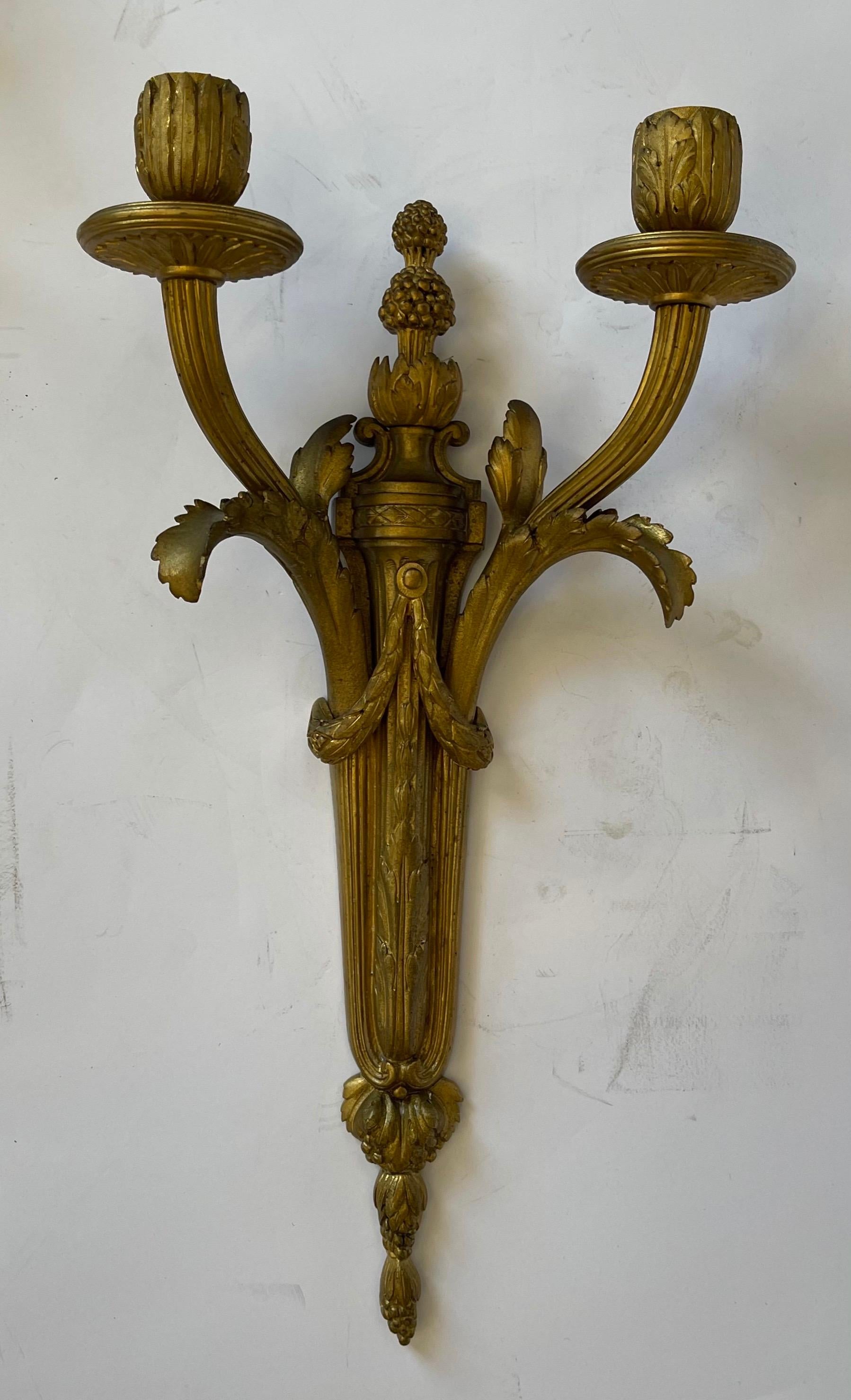 A fine French neoclassical / Regency bronze Empire two arm swag urn two arm sconces,
We are happy to have the sconces wired for you if required.