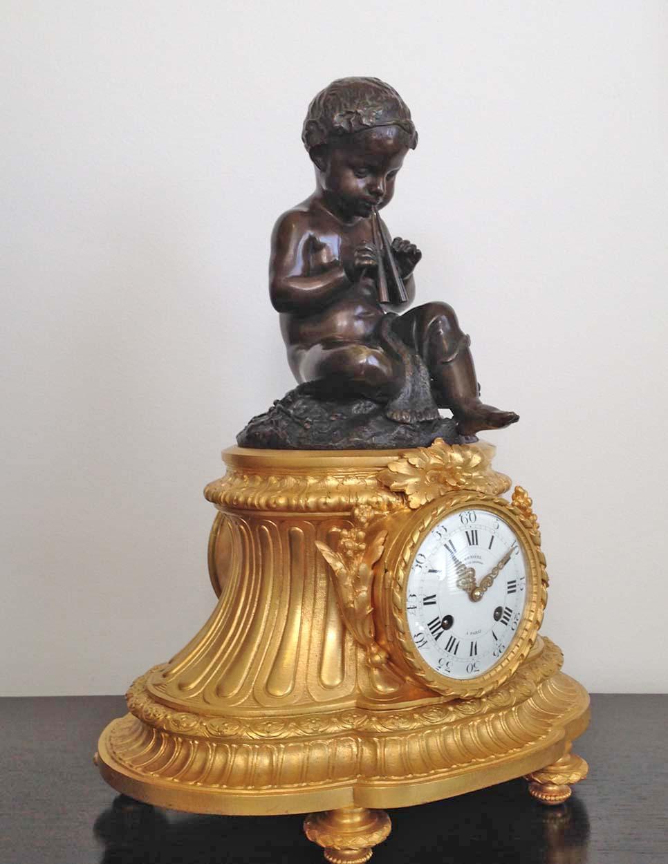A fine French 19th century Louis XVI style ormolu and patinated bronze clock signed by renowned Paris clock maker Denière. 

Surmounted by the patinated bronze figure of a partly draped child wearing a wreath of leaves and playing an aulos (Greek