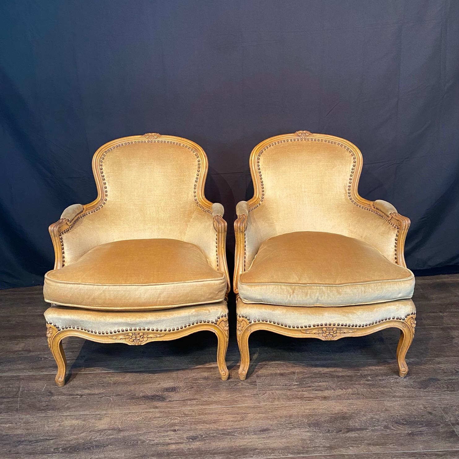 Superb pair of French medium sized Louis XV walnut carved chairs with lovely gold velvet in very good condition! The chairs have beautiful lines and floral carving on crests and aprons. Found in the South of France.
#8008
H arm 22.5” x H seat 16.5”