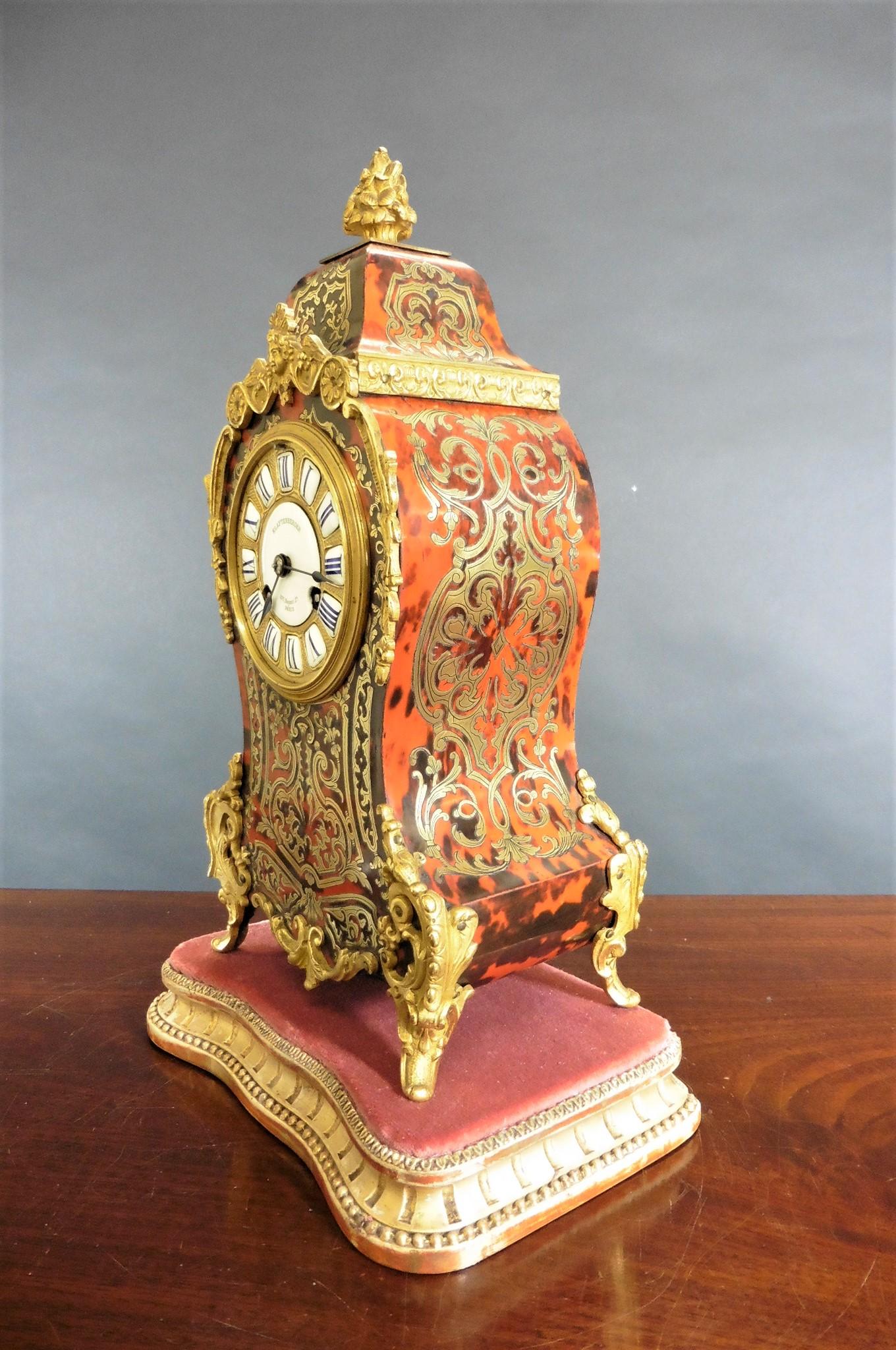 Fine French Tortoiseshell Boulle clock


Waisted case with red tortoiseshell inlaid with fine brass decoration surmounted by an ormolu finial, ormolu mounts throughout and standing on raised bracket feet. The sides and rear door also decorated