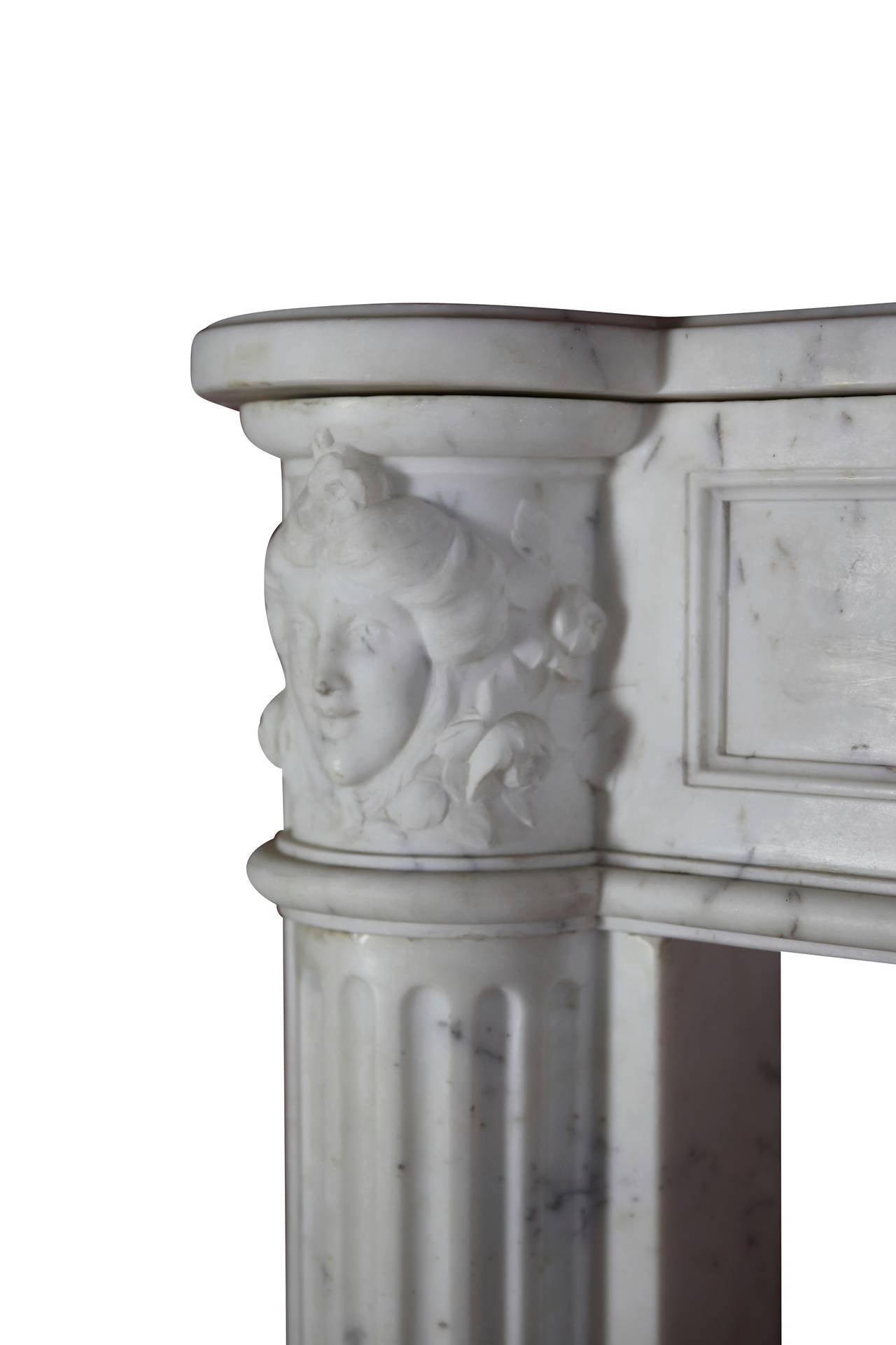 This is a bespoke original antique French fireplace mantel (fireplace) in white statuary marble from the Louis XVI period, 18th century. Exquisite carving. It is still in great condition and ready to be installed. A vintage mantlepiece in a museum
