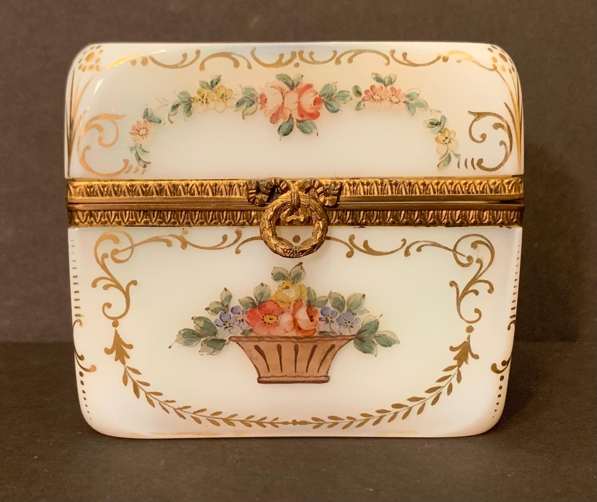 A wonderful French white opaline glass with ormolu bronze mounts and hand painting on all sides as well as the top, jewelry / vanity box.
 