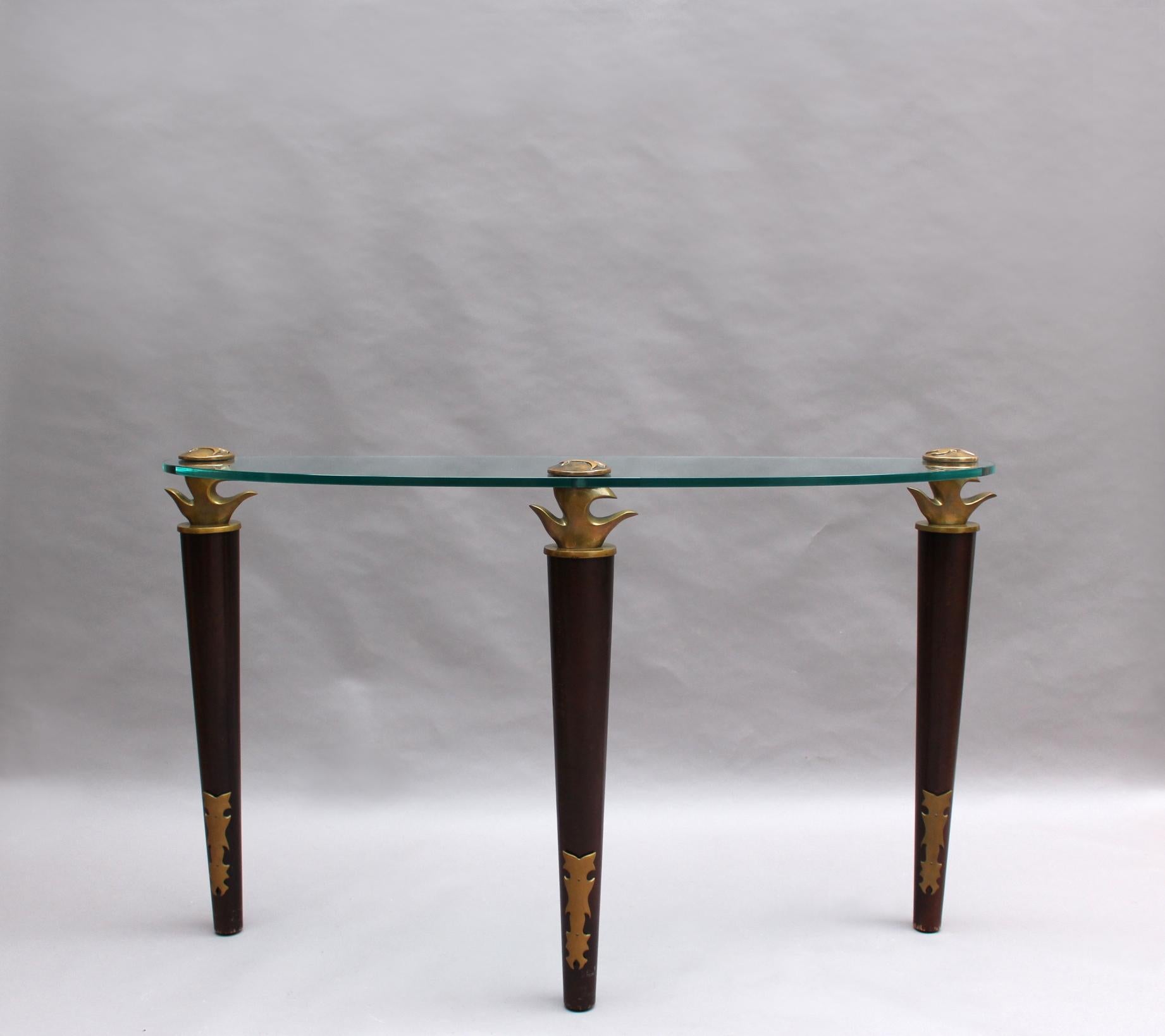 Elizabeth Garouste and Mattia Bonetti, fine 1980s glass top console with 3 stained beech and cast bronze legs.
Stamped BG.