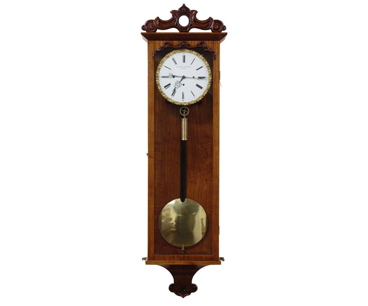 Fine Fruitwood Grand-Sonnerie Striking Vienna Regulator
Four pillar, triple train movement of short duration with dead beat escapement incorporating tall inverted v-shaped pallets regulated by a brass lenticular bon pendulum with ebonised wooden